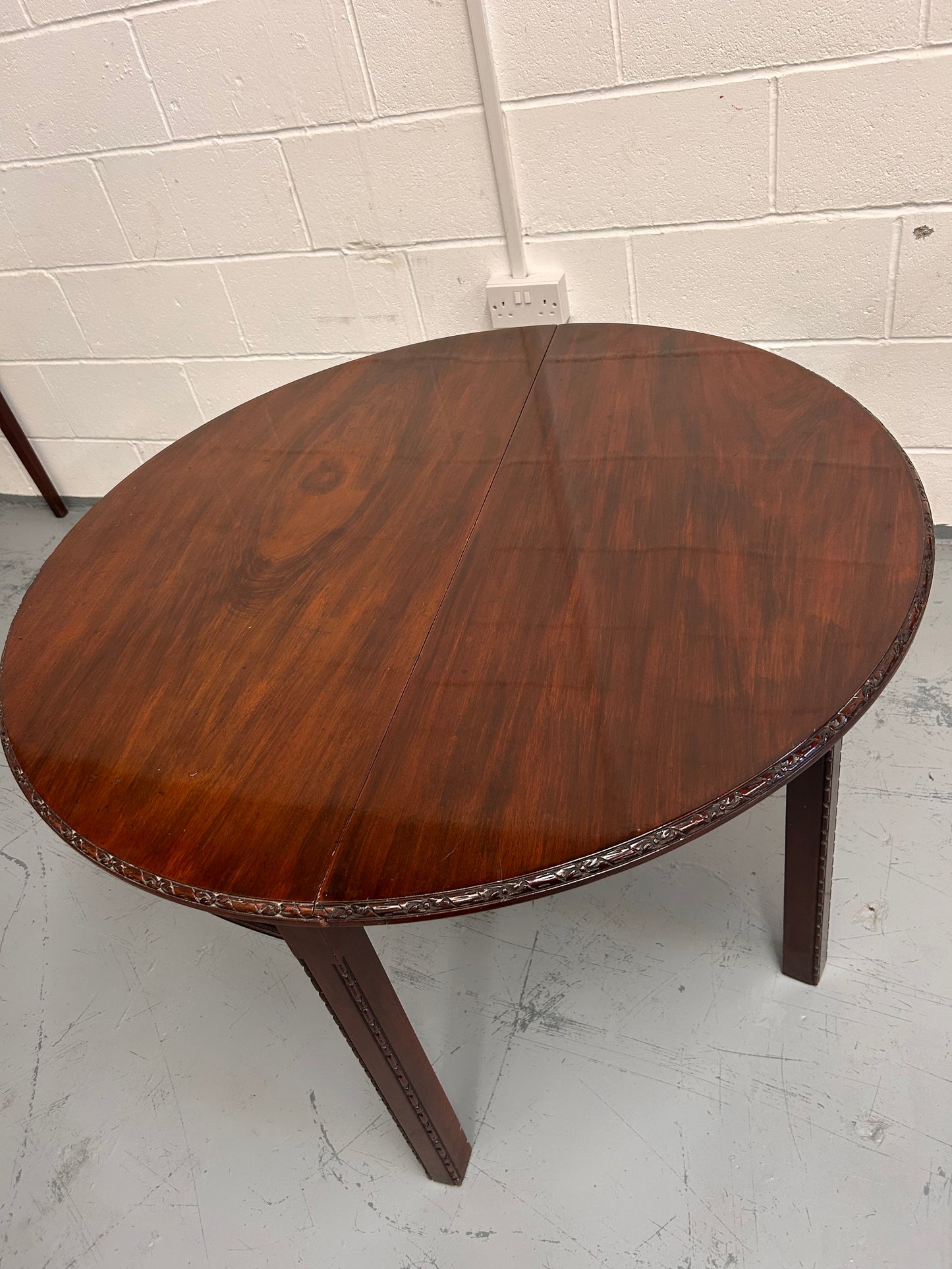 20th century demilune Table with carved edges and opens out to twice the size