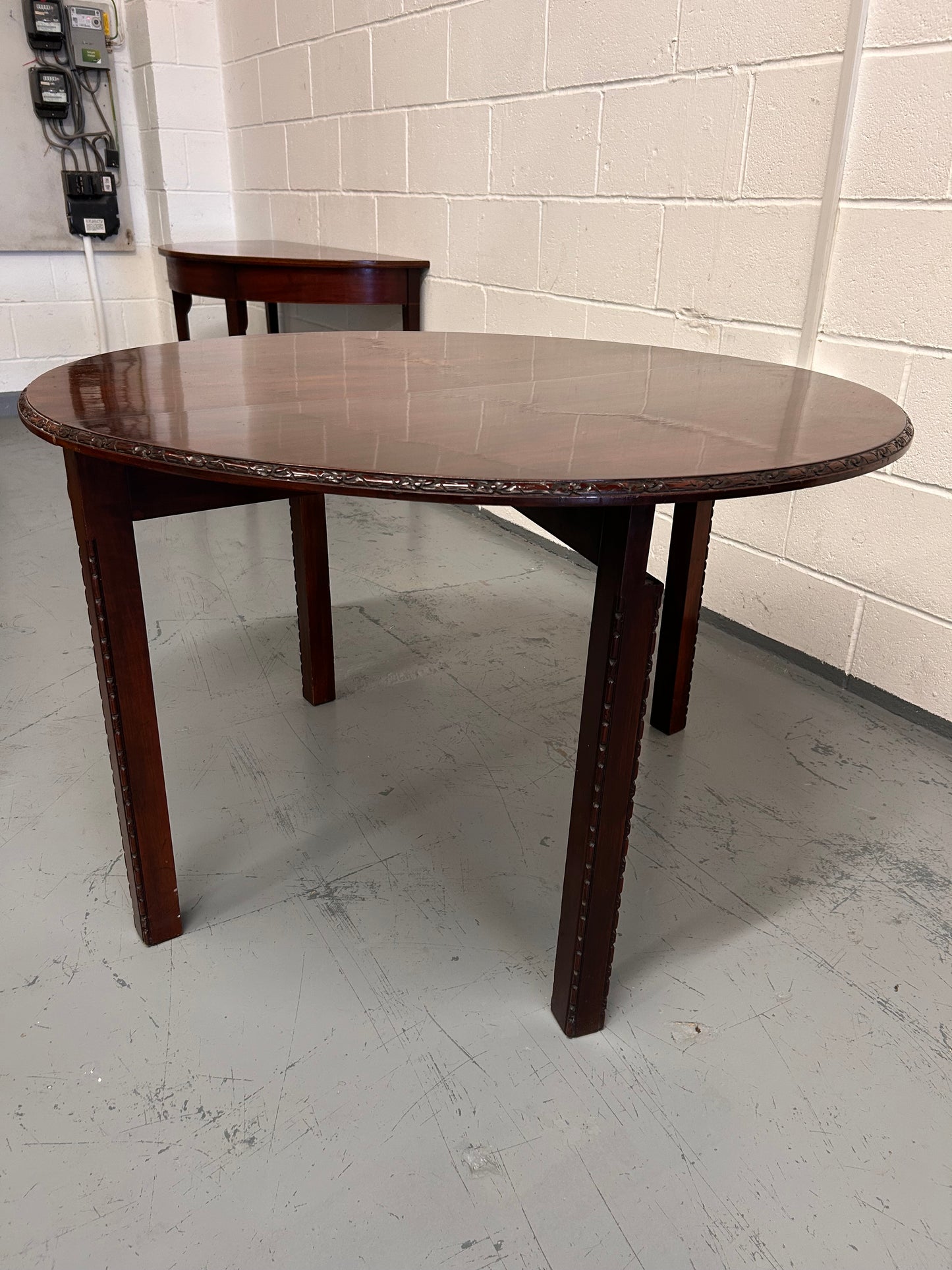 20th century demilune Table with carved edges and opens out to twice the size