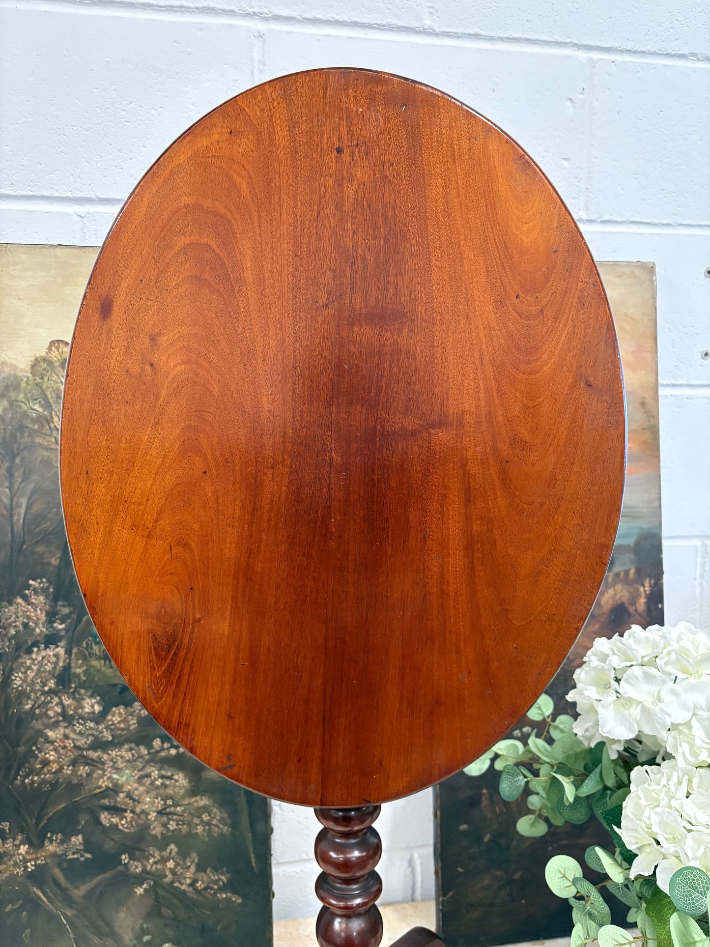 19th century mahogany oval topped occasional table on bobbin support and tripod legs