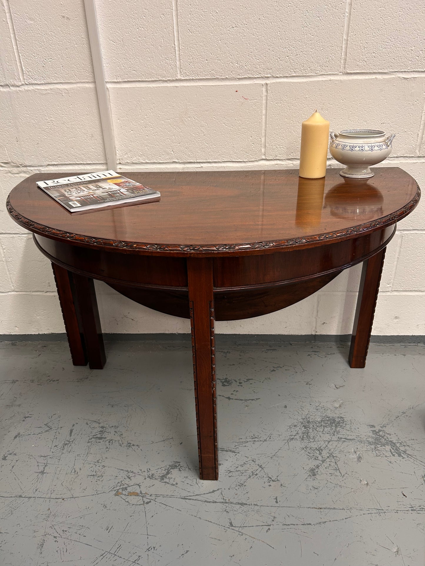 20th century demilune Table with carved edges and opens out to twice the size