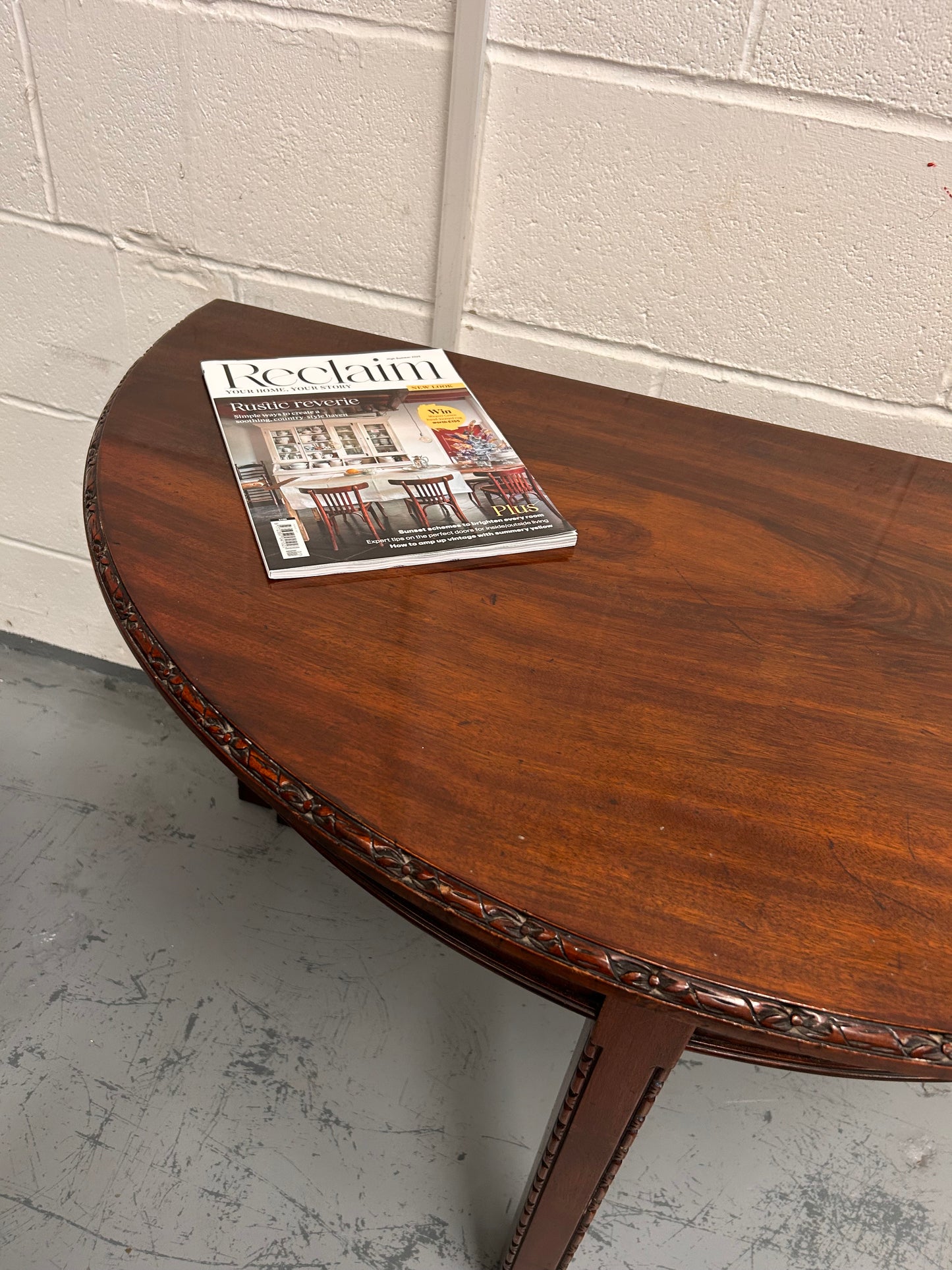20th century demilune Table with carved edges and opens out to twice the size