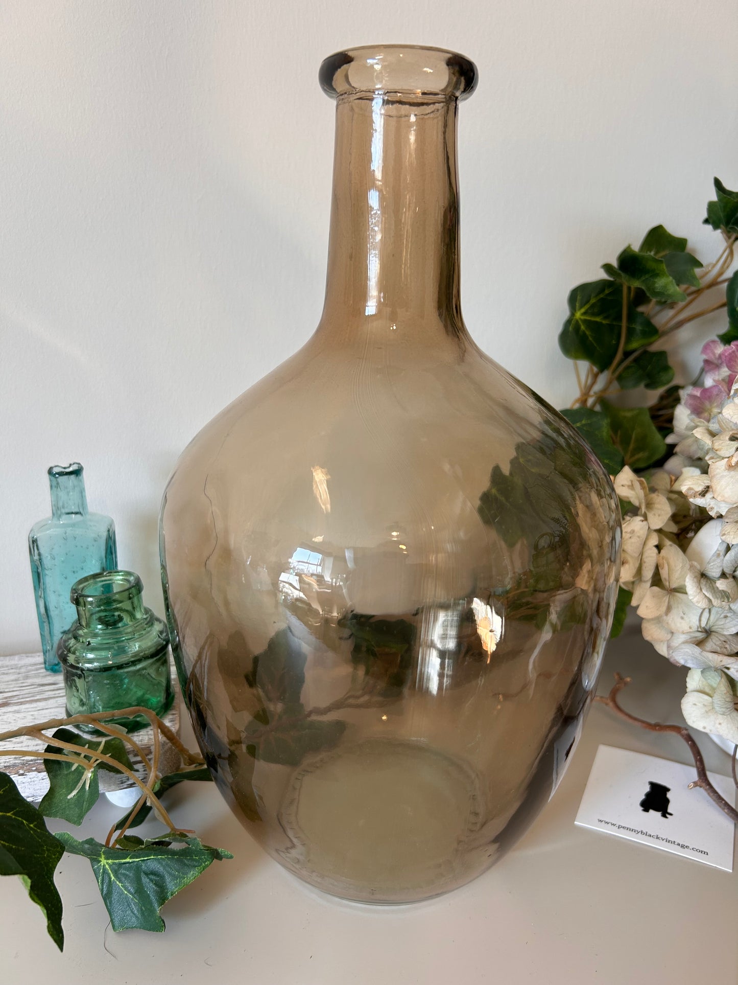 A vintage style amber bottle made from recycled glass