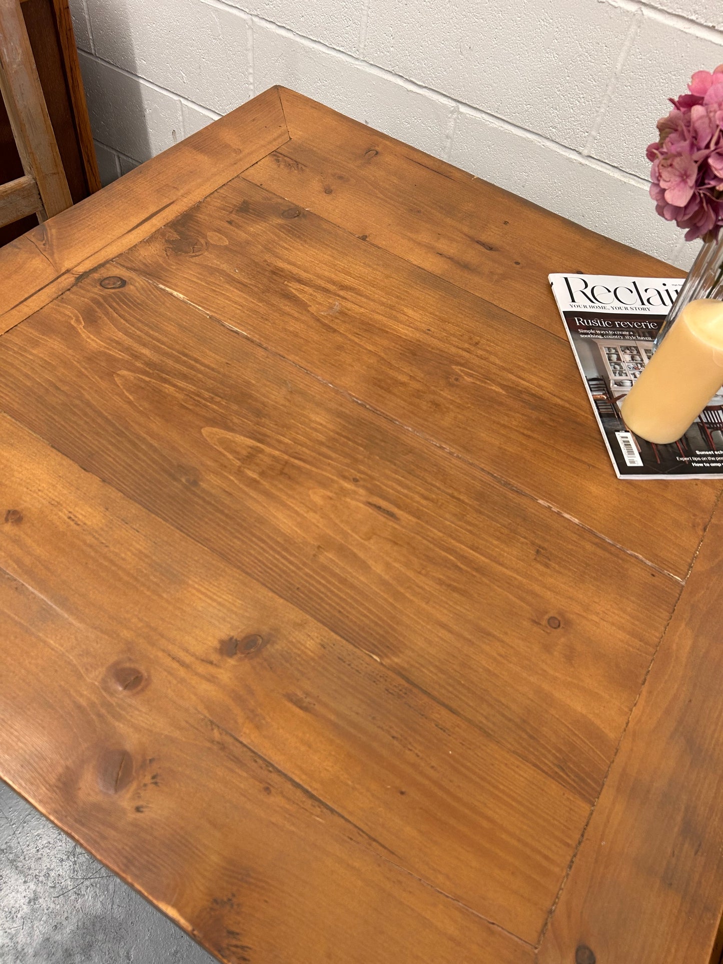 Preloved Rustic four seater table with thick wooden top and black metal base.