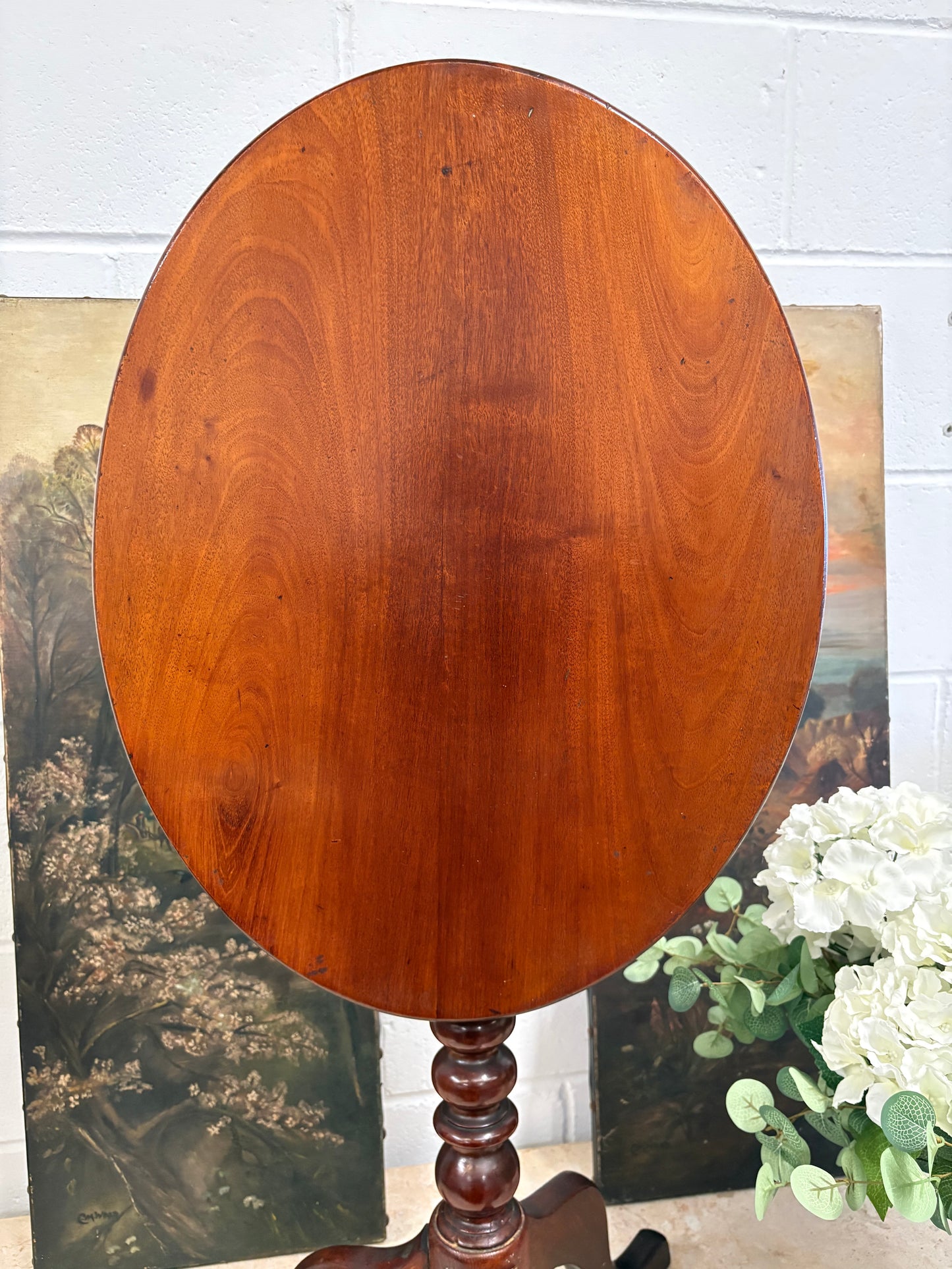 19th century mahogany oval topped occasional table on bobbin support and tripod legs
