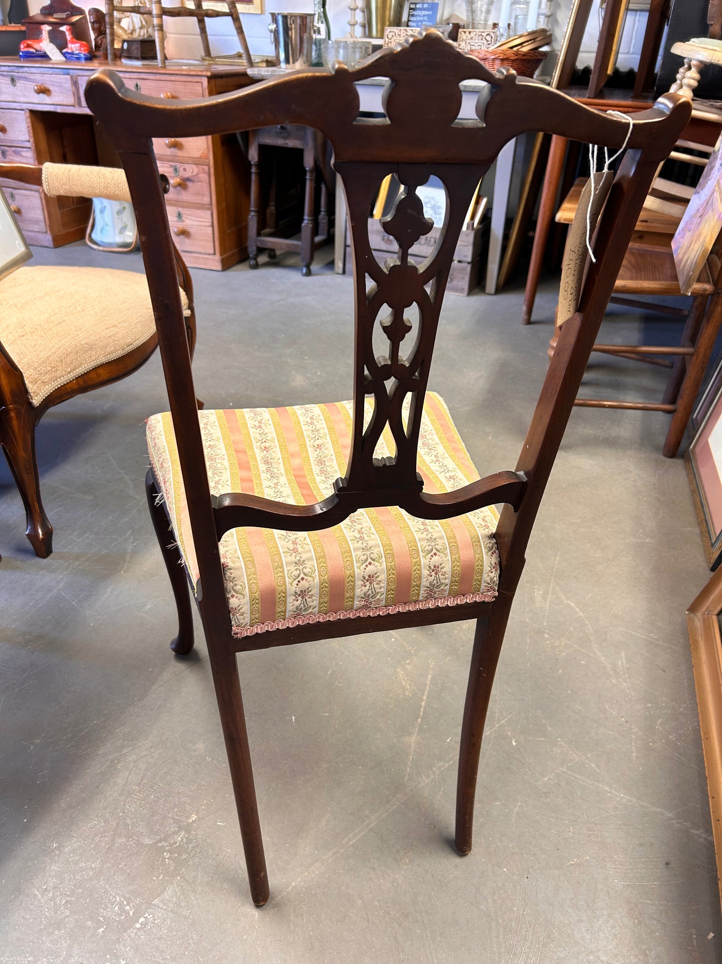 A pair of pretty pink fabric carved wood Edwardian chairs