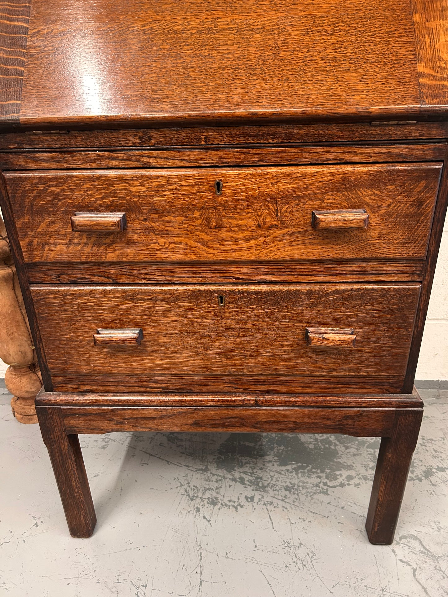 A lovely little vintage compact oak bureau with drop down writing surface and storage