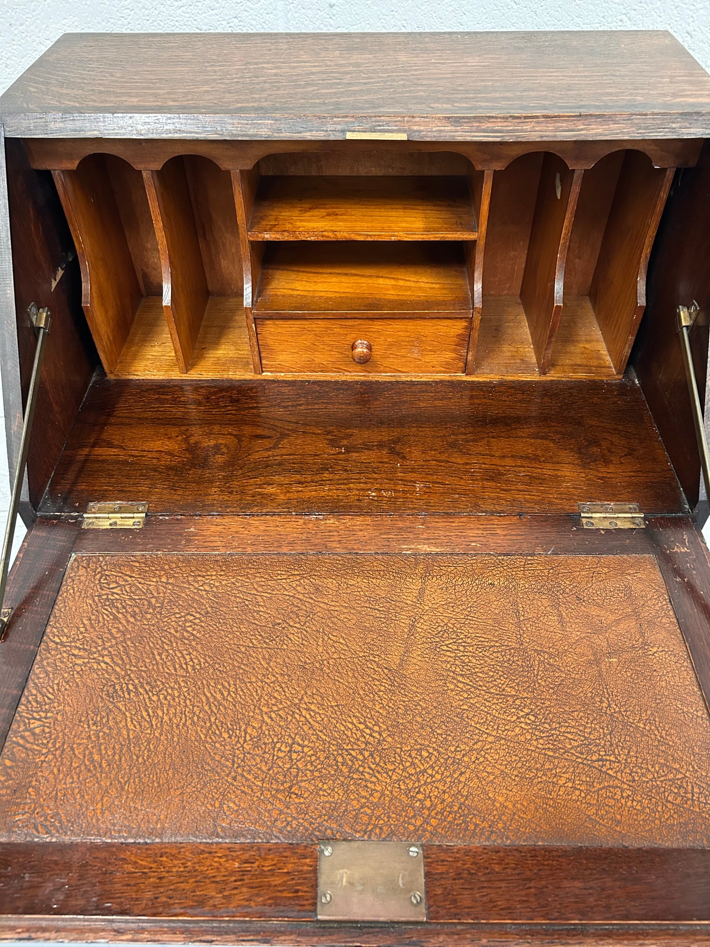 A lovely little vintage compact oak bureau with drop down writing surface and storage