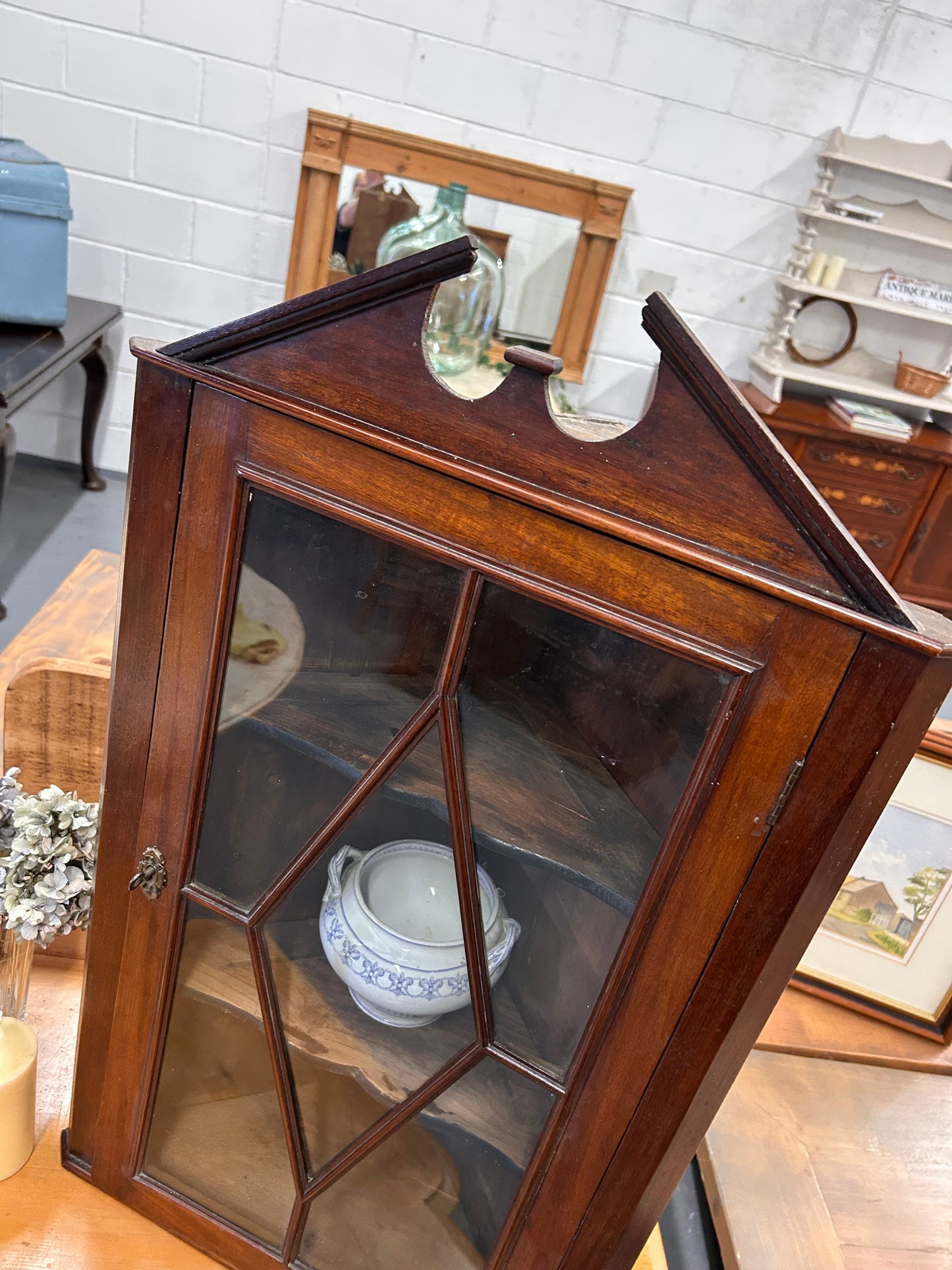 An Edwardian mahogany corner wall cabinet with a glazed front great condition