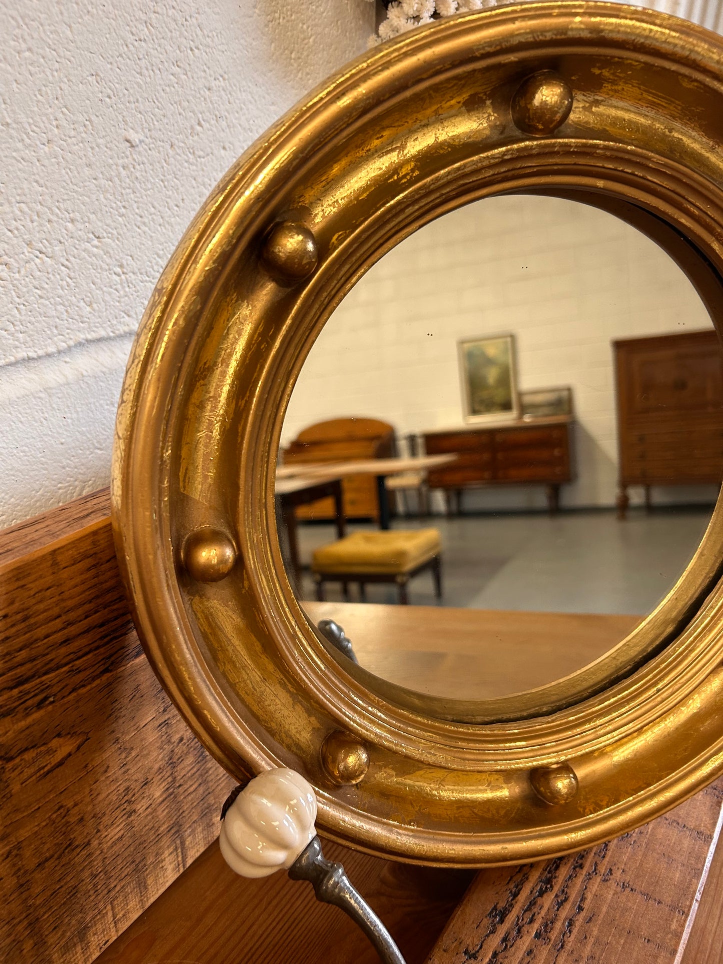 Antique heavy gilt porthole mirror with musket ball frame 