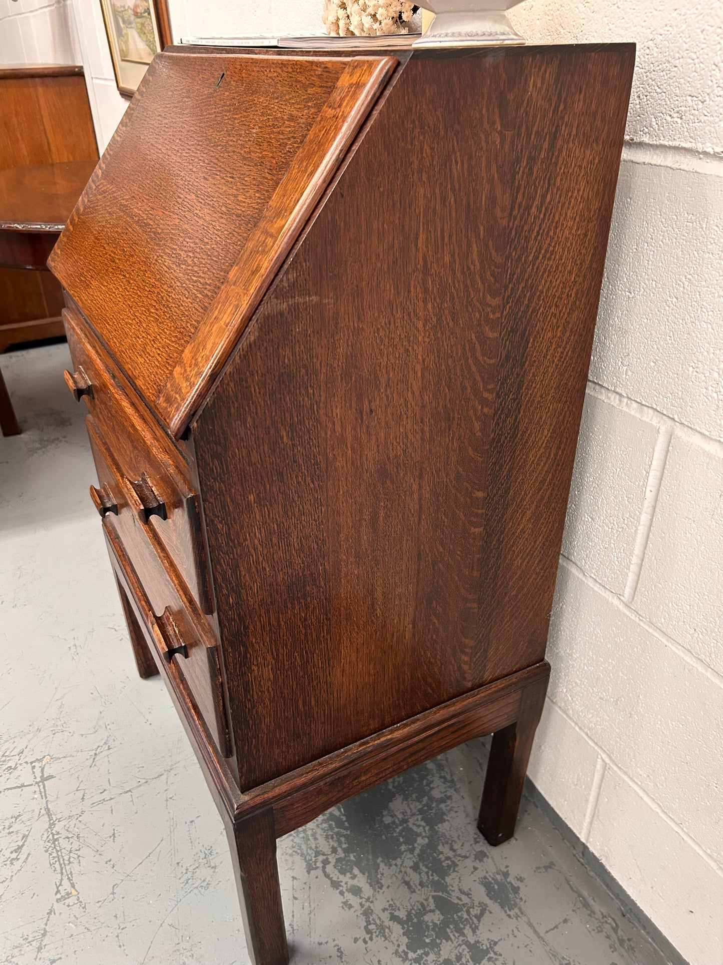 A lovely little vintage compact oak bureau with drop down writing surface and storage