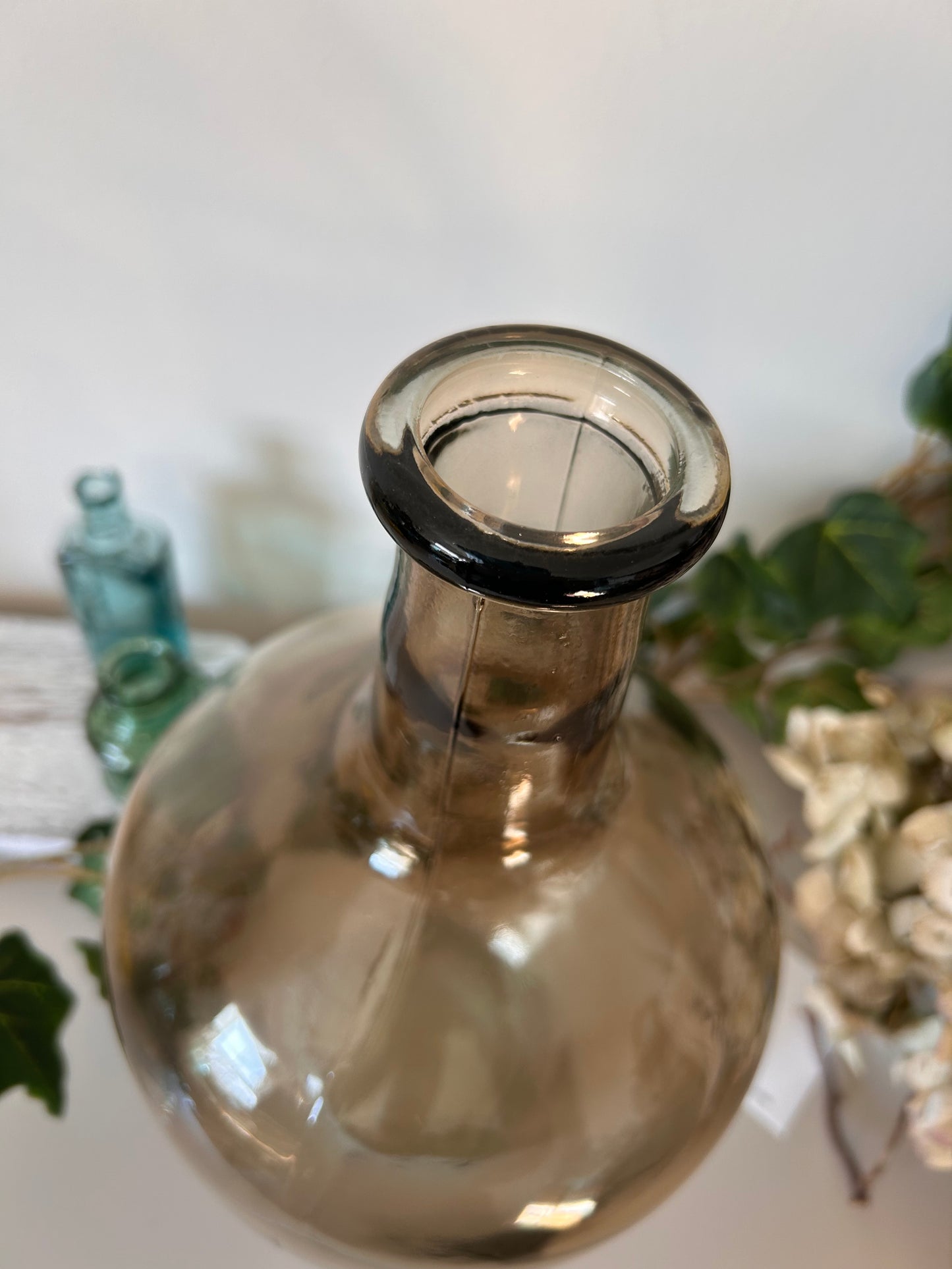 A vintage style amber bottle made from recycled glass