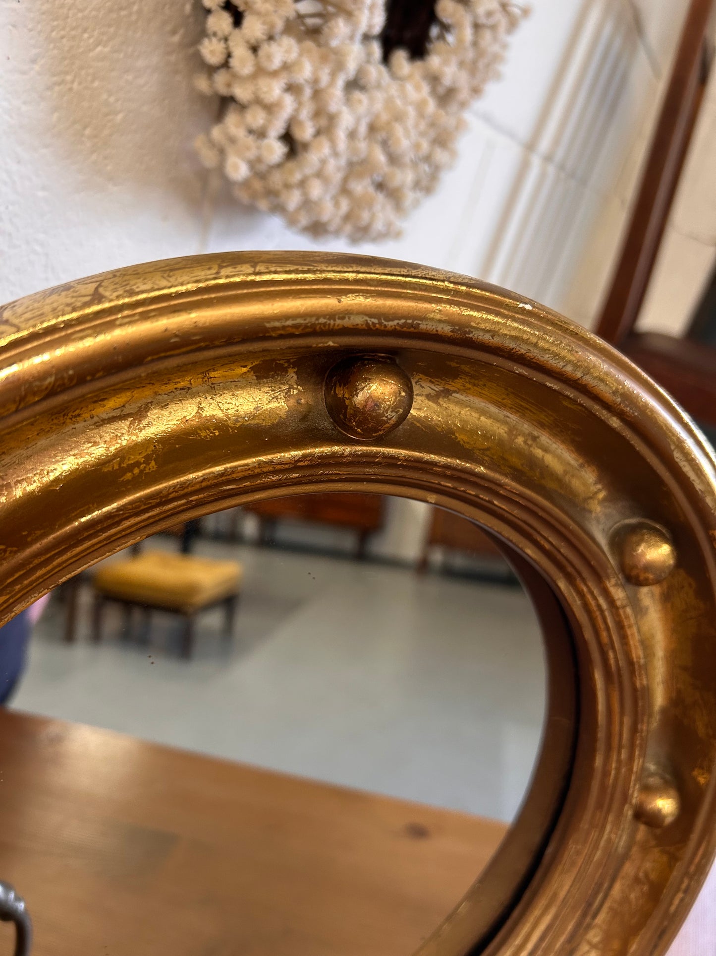Antique heavy gilt porthole mirror with musket ball frame 