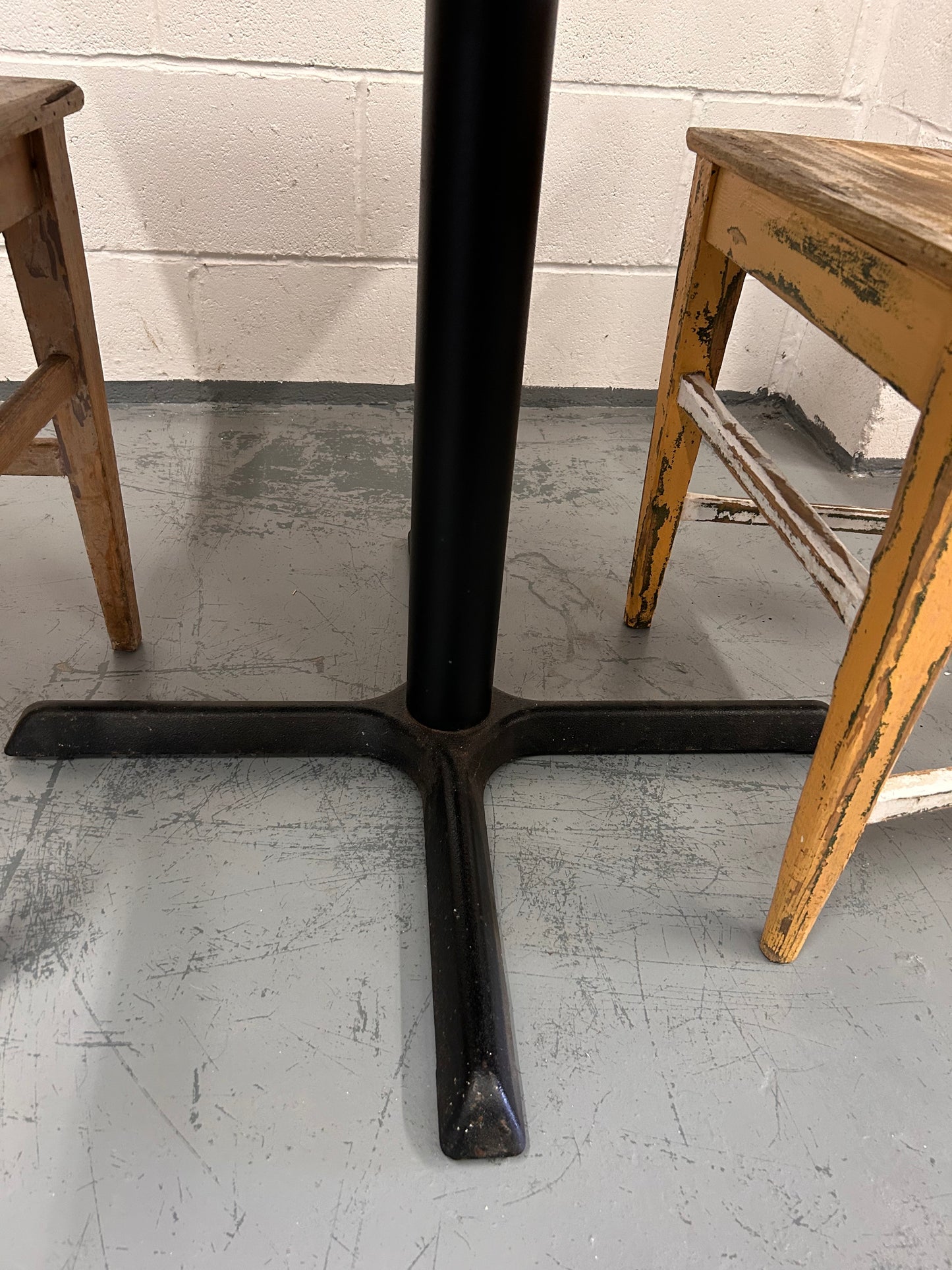 Preloved Rustic four seater table with thick wooden top and black metal base.