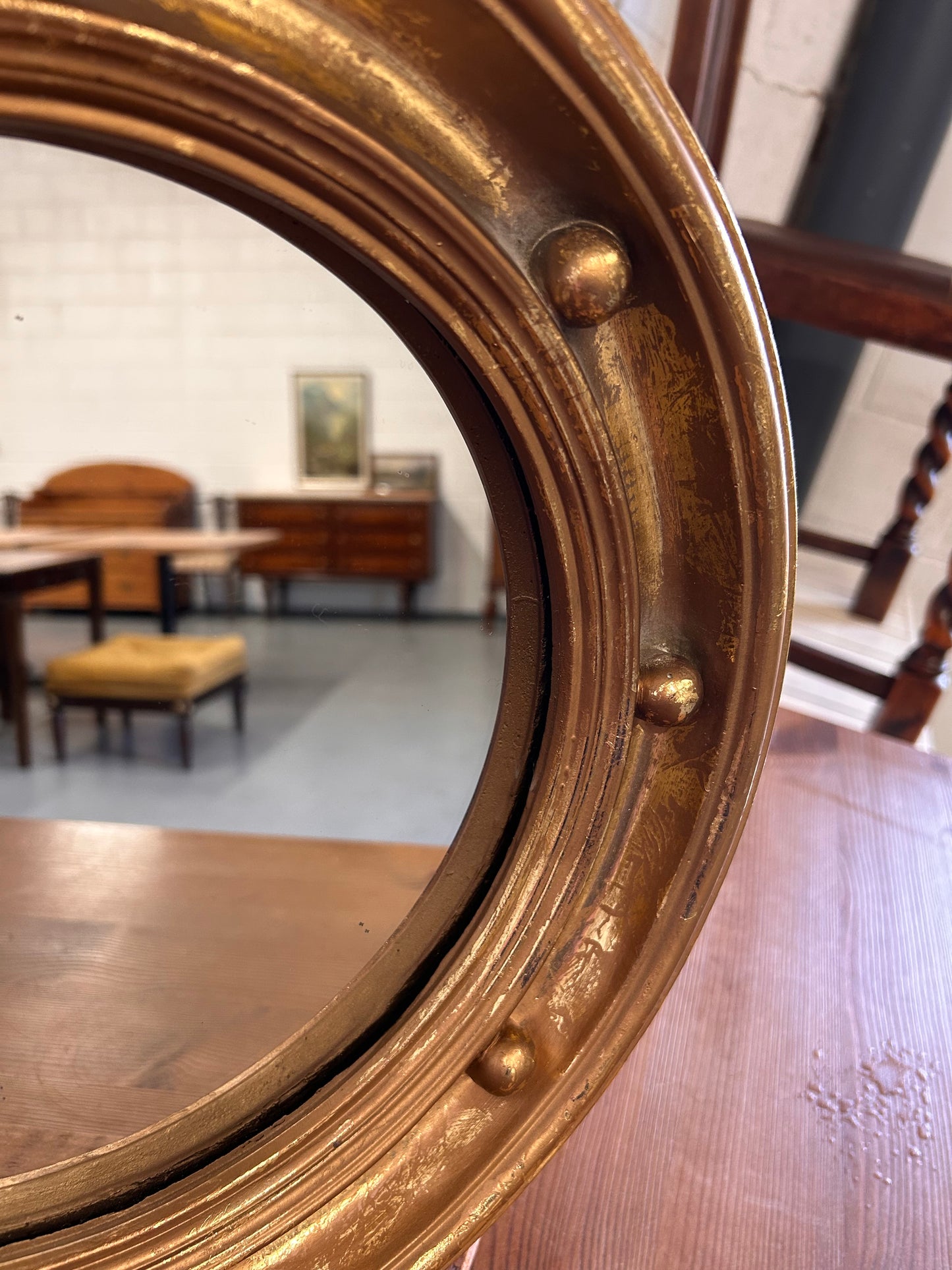 Antique heavy gilt porthole mirror with musket ball frame 