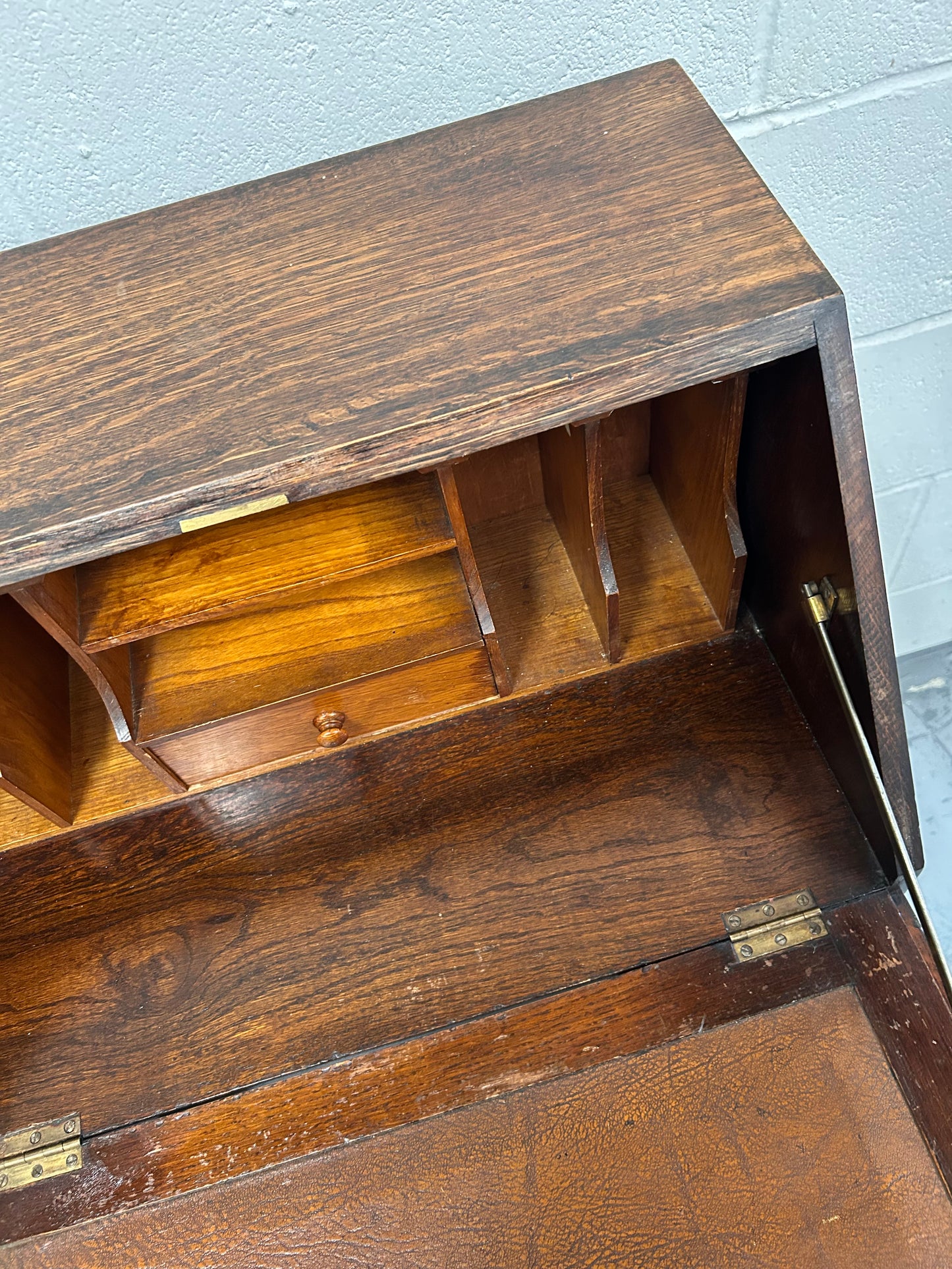 A lovely little vintage compact oak bureau with drop down writing surface and storage