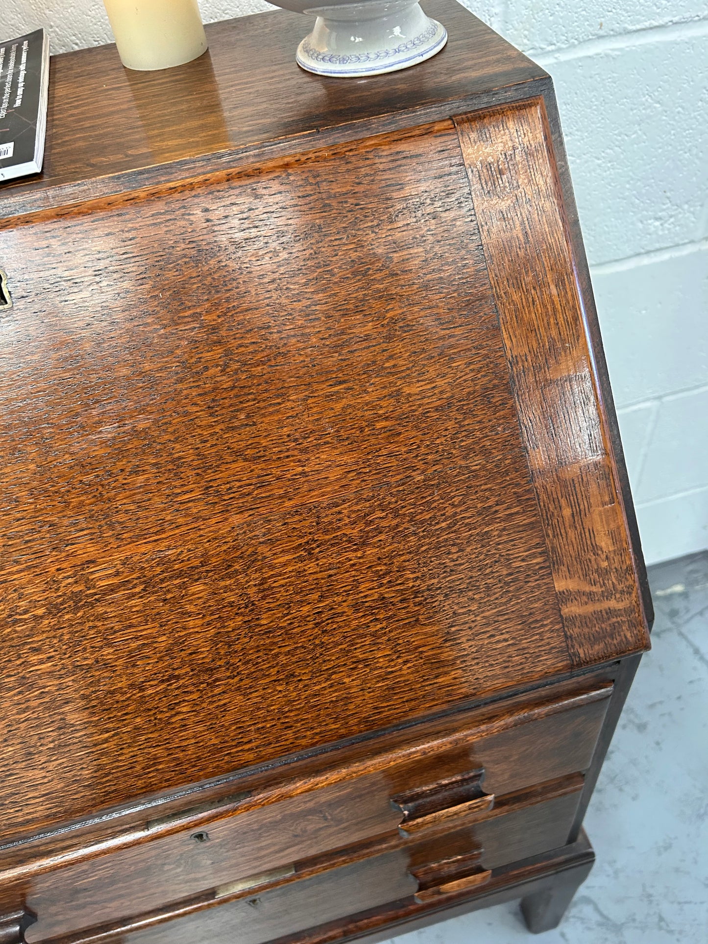 A lovely little vintage compact oak bureau with drop down writing surface and storage