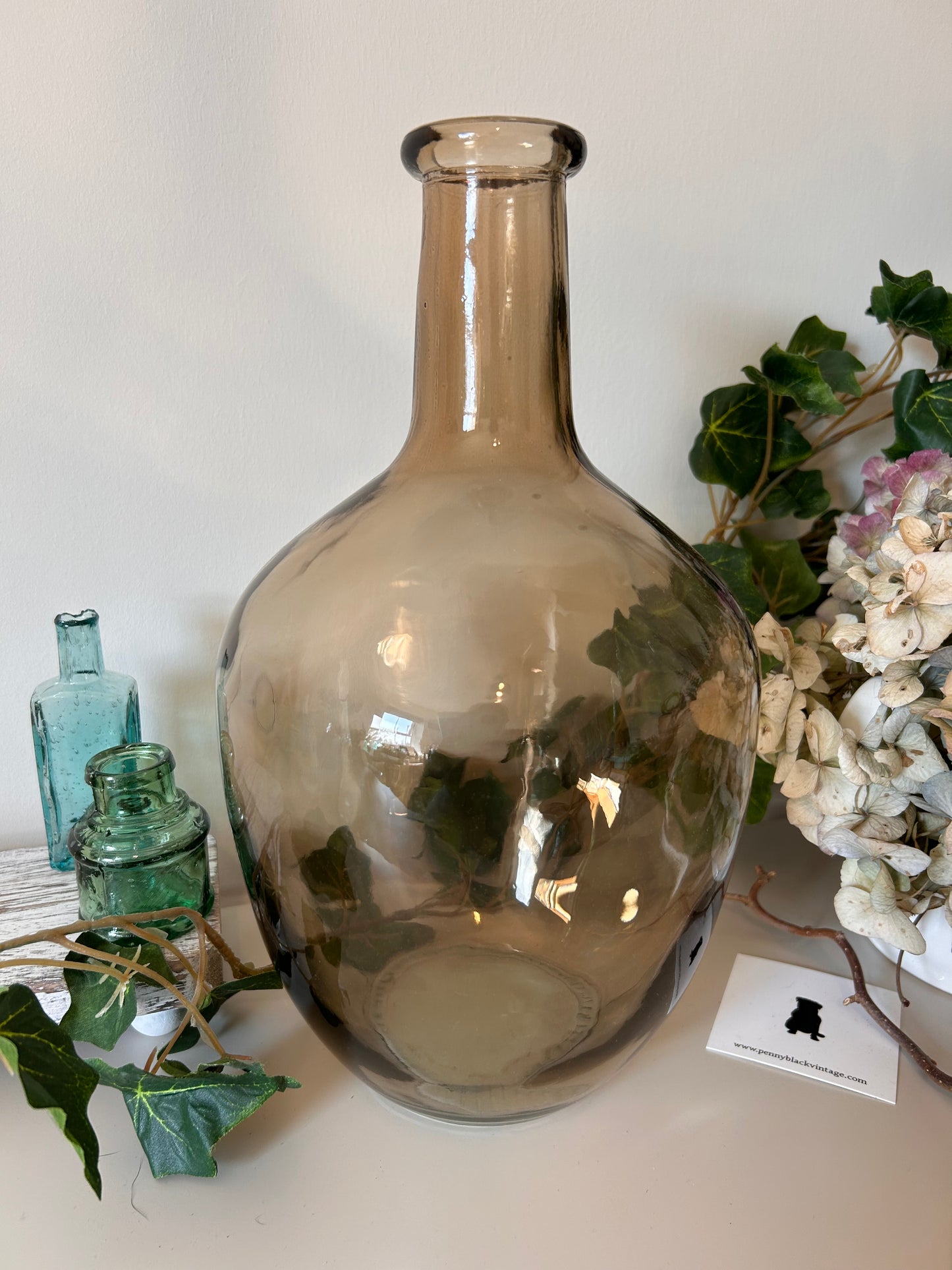 A vintage style amber bottle made from recycled glass