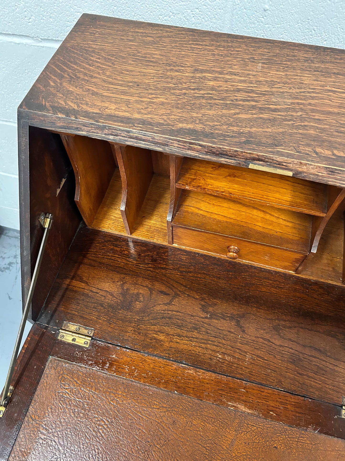 A lovely little vintage compact oak bureau with drop down writing surface and storage