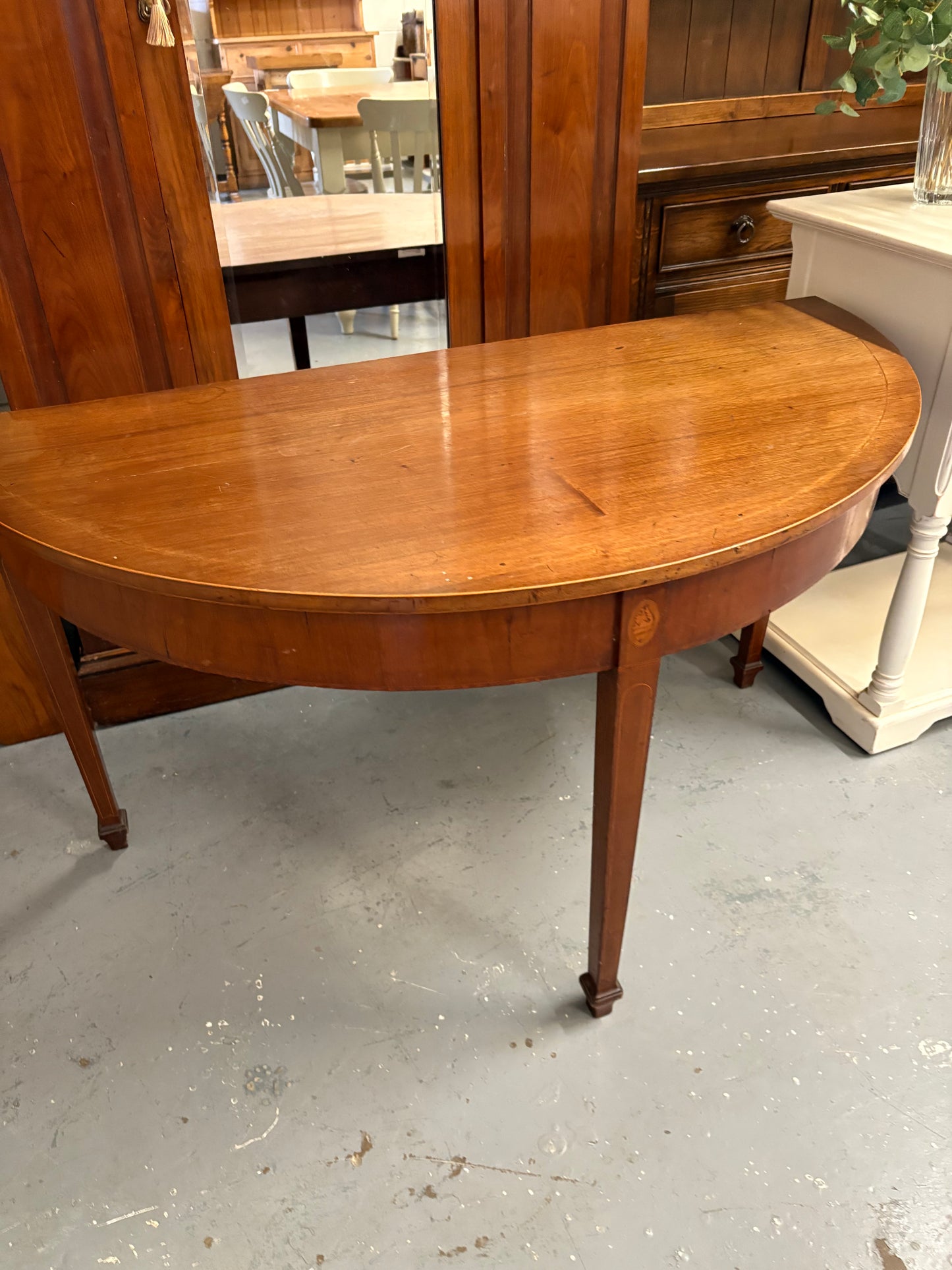 A 19th century mahogany demi-lune console table with rounded top