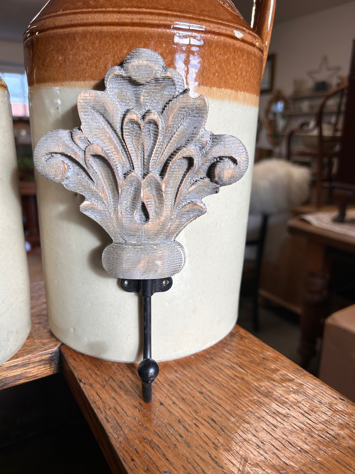 Taupe wood acanthus and black metal wall hook