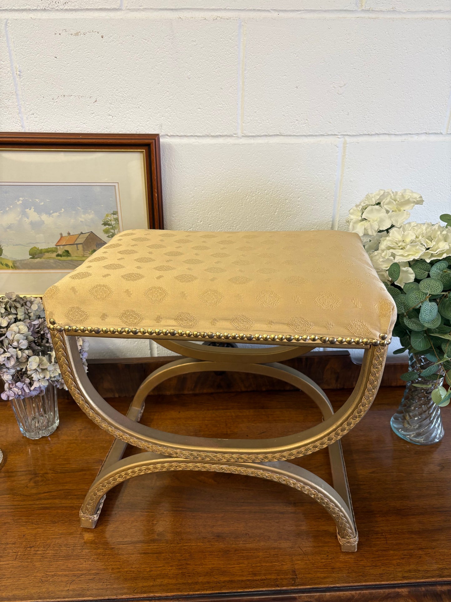 Vintage Regency Yellow Gold upholstered stool with a cross X Frame