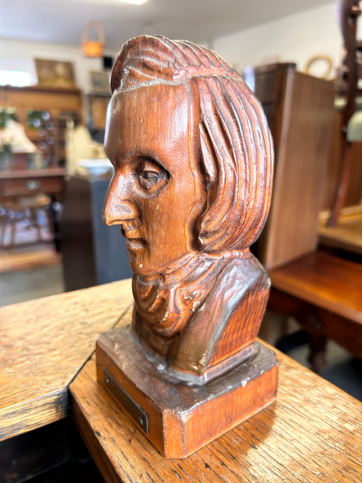 A wooden antique carved bust of the composer Chopin