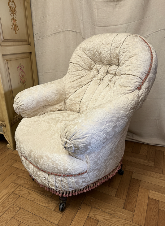 Victorian Antique button-back nursing chair with cream floral damask fabric on castors