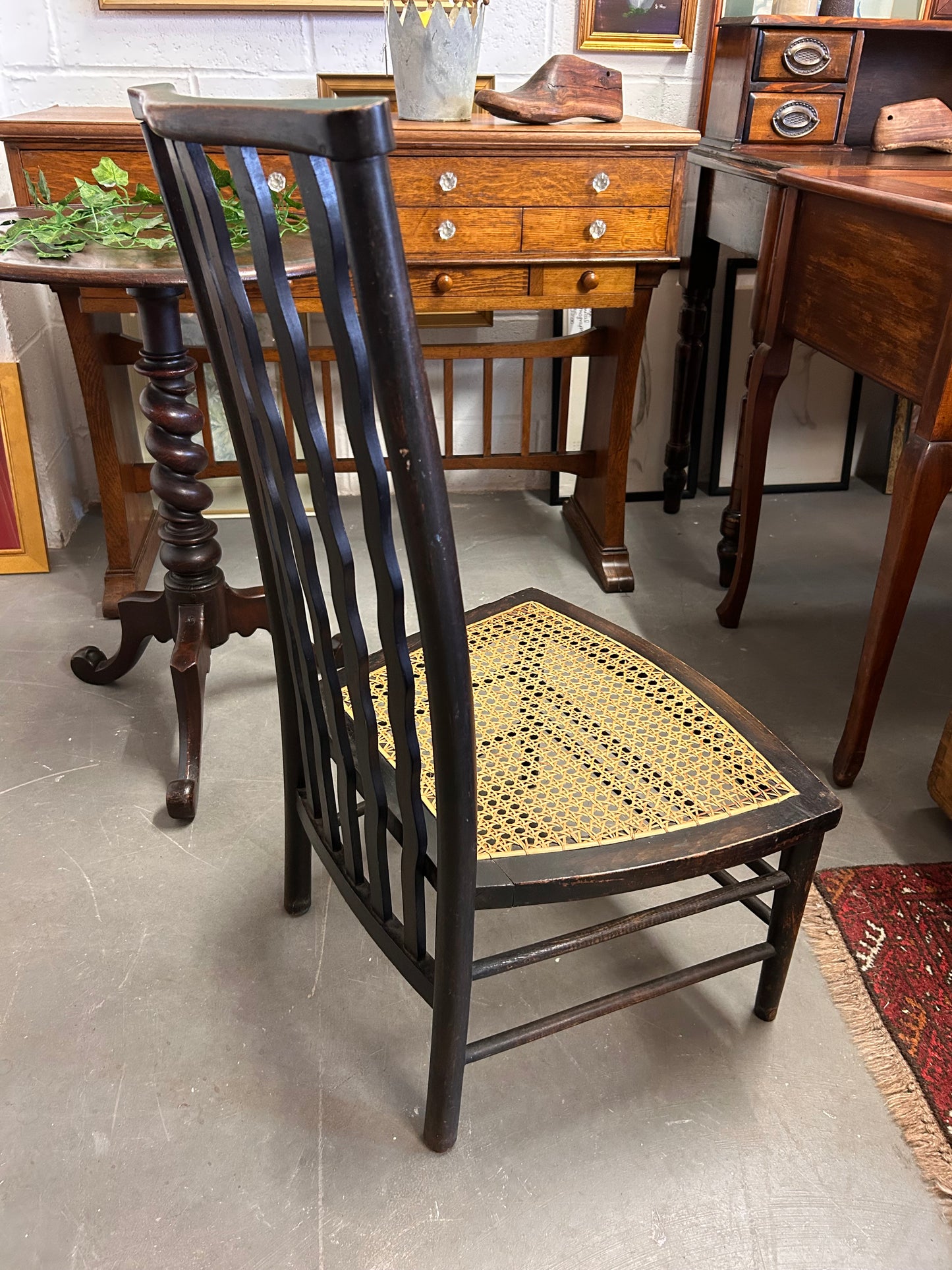 Morris and Co made for Liberty a wavy back rattan seat fireside chair great condition