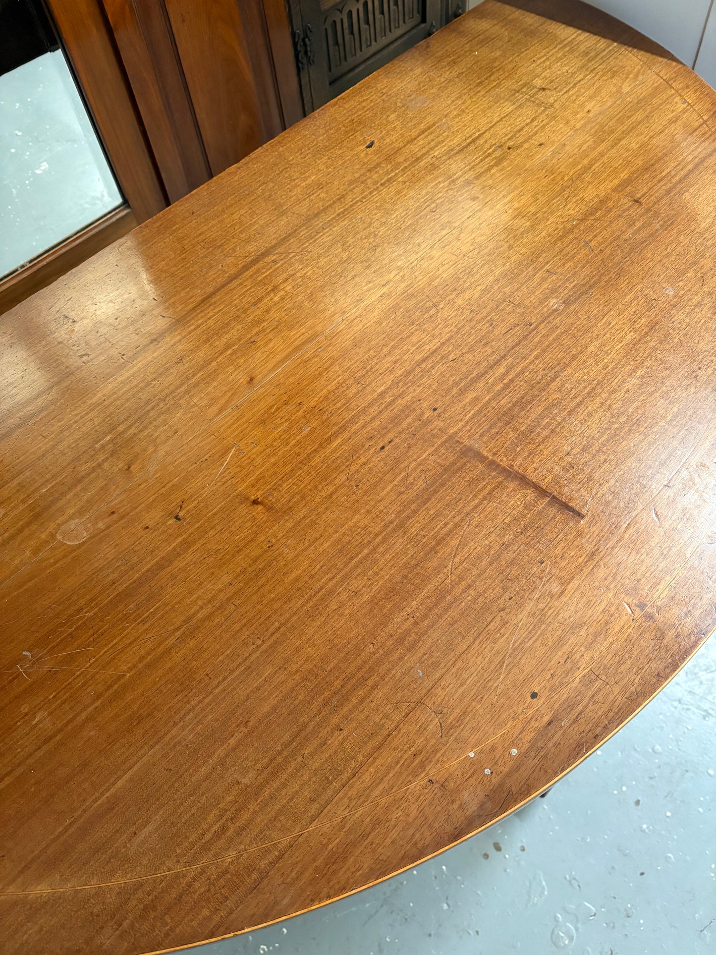 A 19th century mahogany demi-lune console table with rounded top