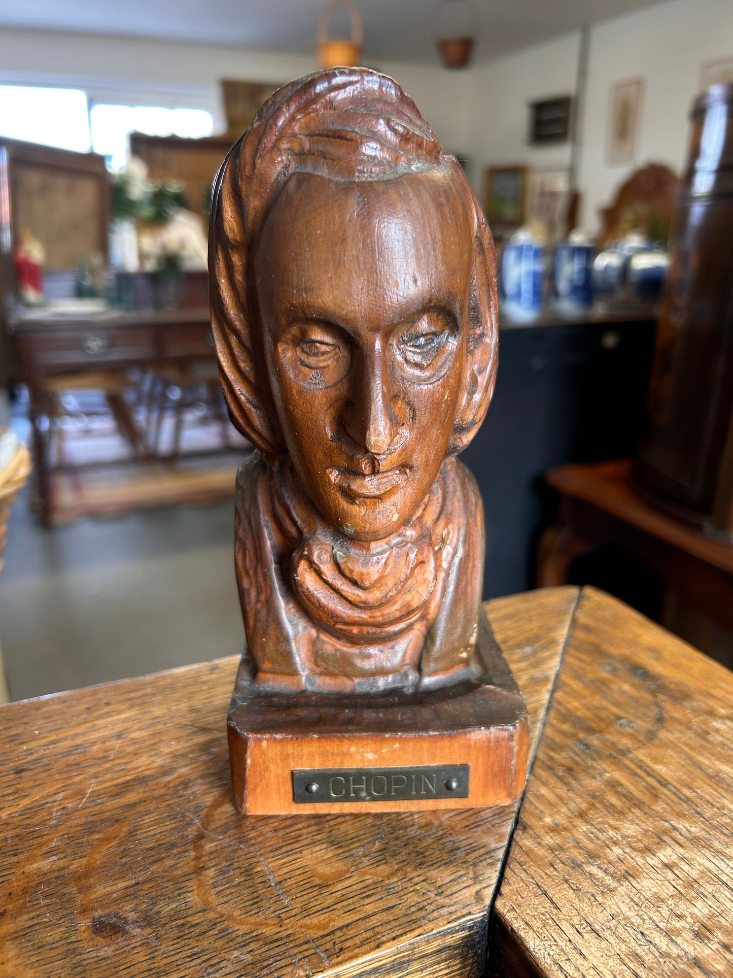 A wooden antique carved bust of the composer Chopin