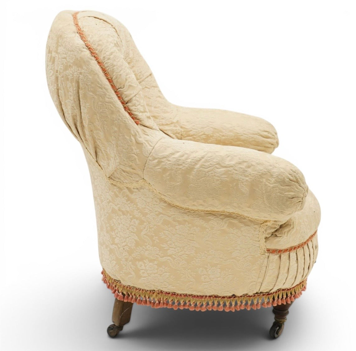 Victorian Antique button-back nursing chair with cream floral damask fabric on castors
