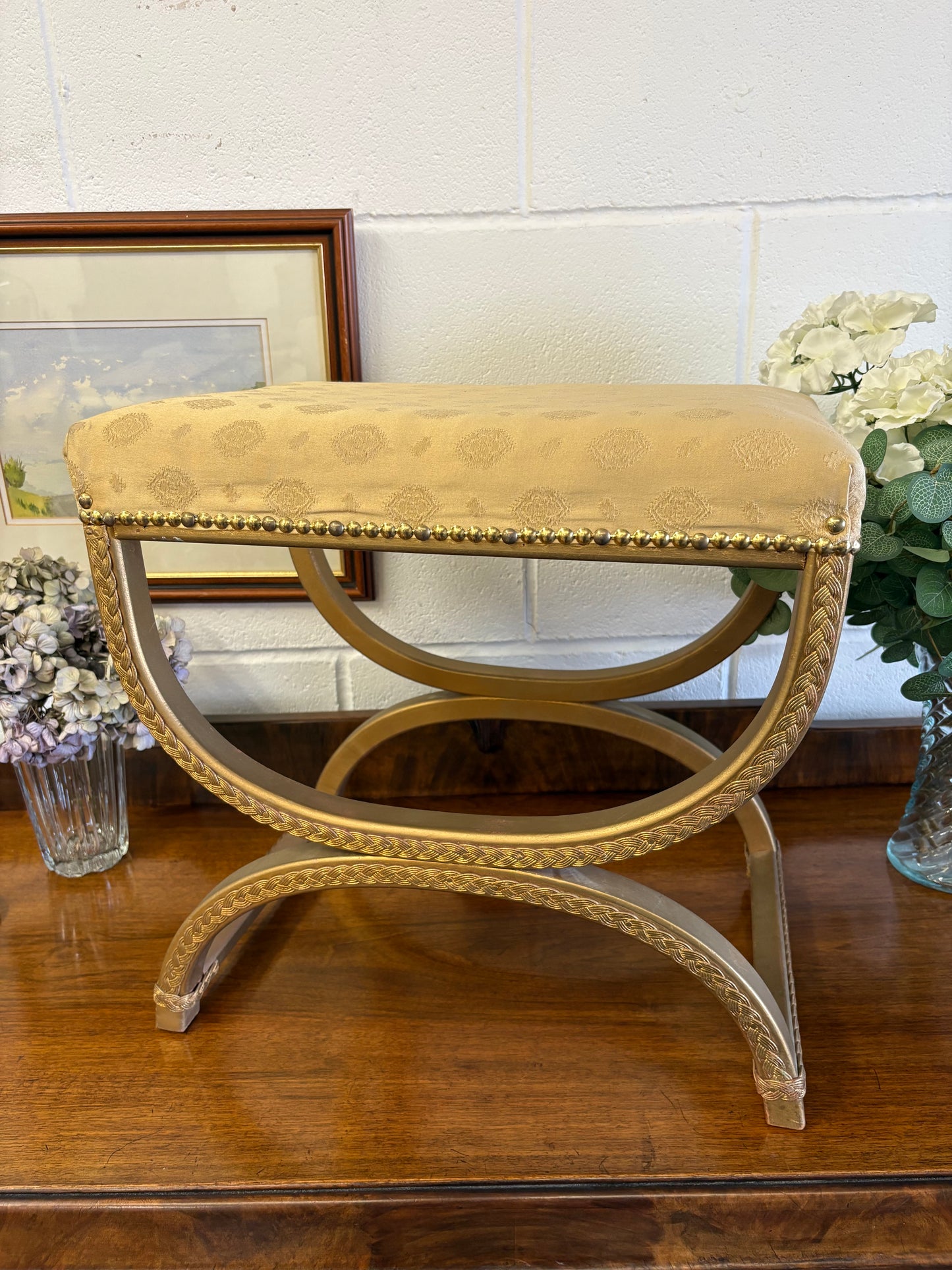 Vintage Regency Yellow Gold upholstered stool with a cross X Frame