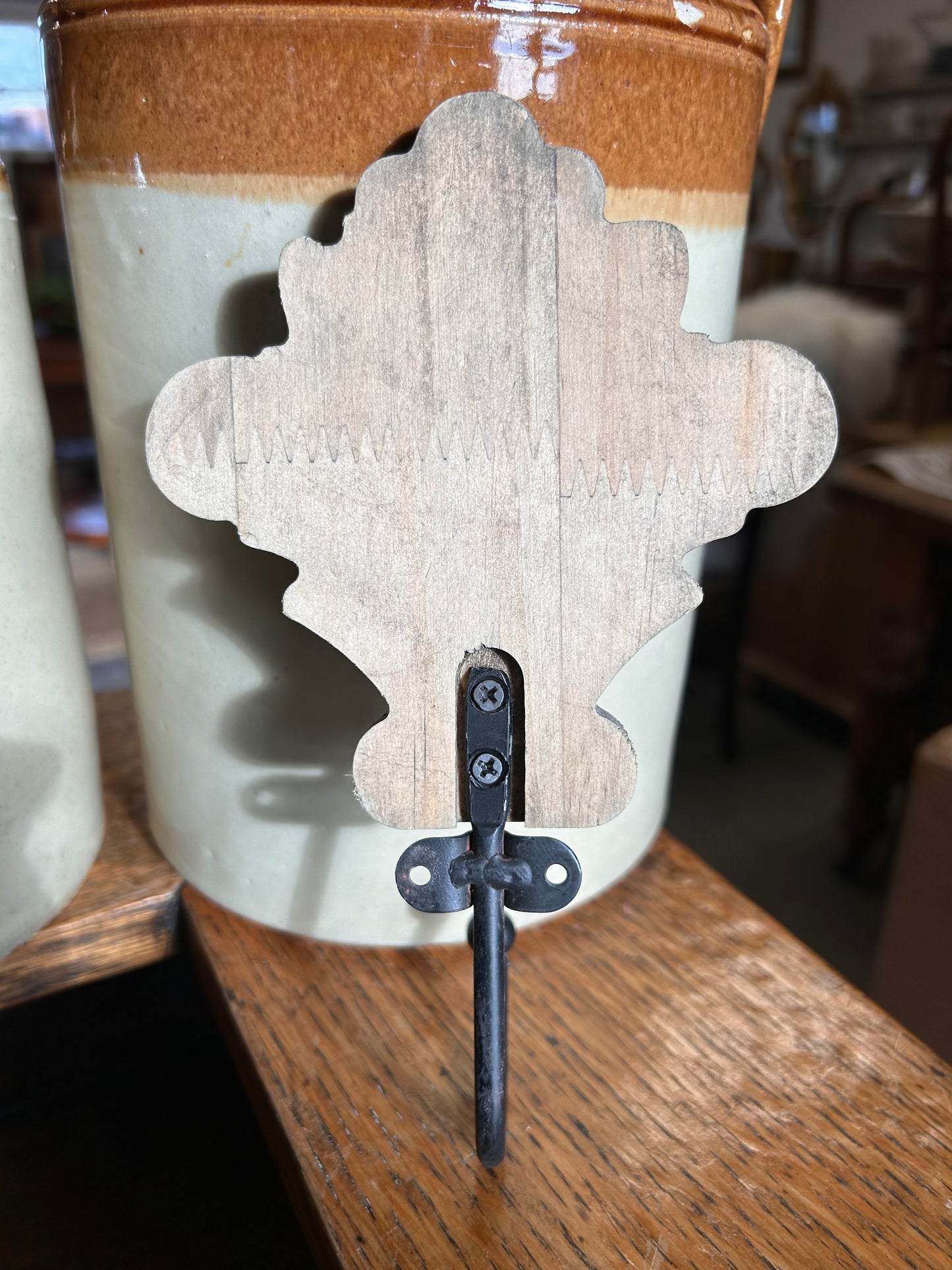 Taupe wood acanthus and black metal wall hook