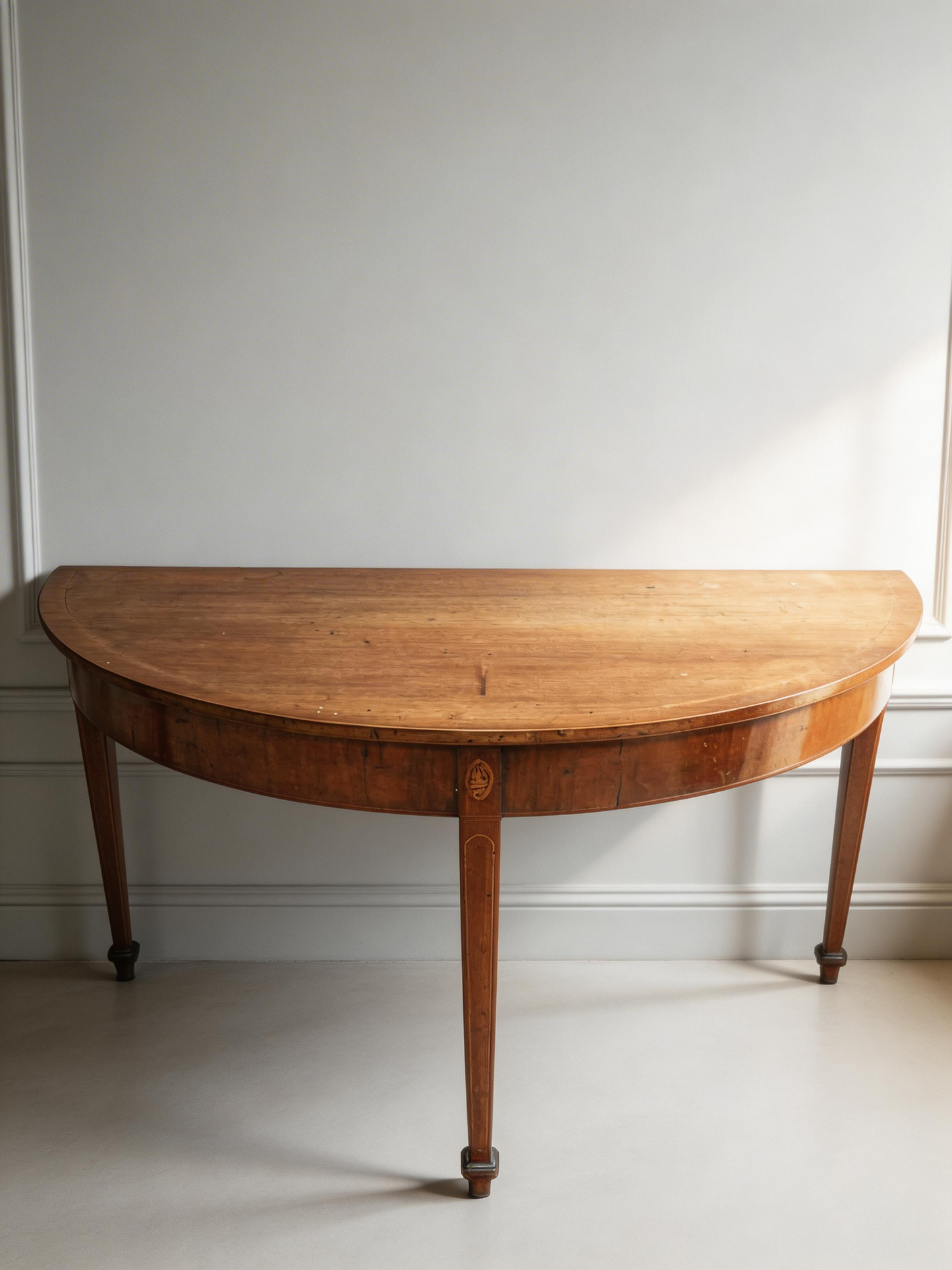 A 19th century mahogany demi-lune console table with rounded top
