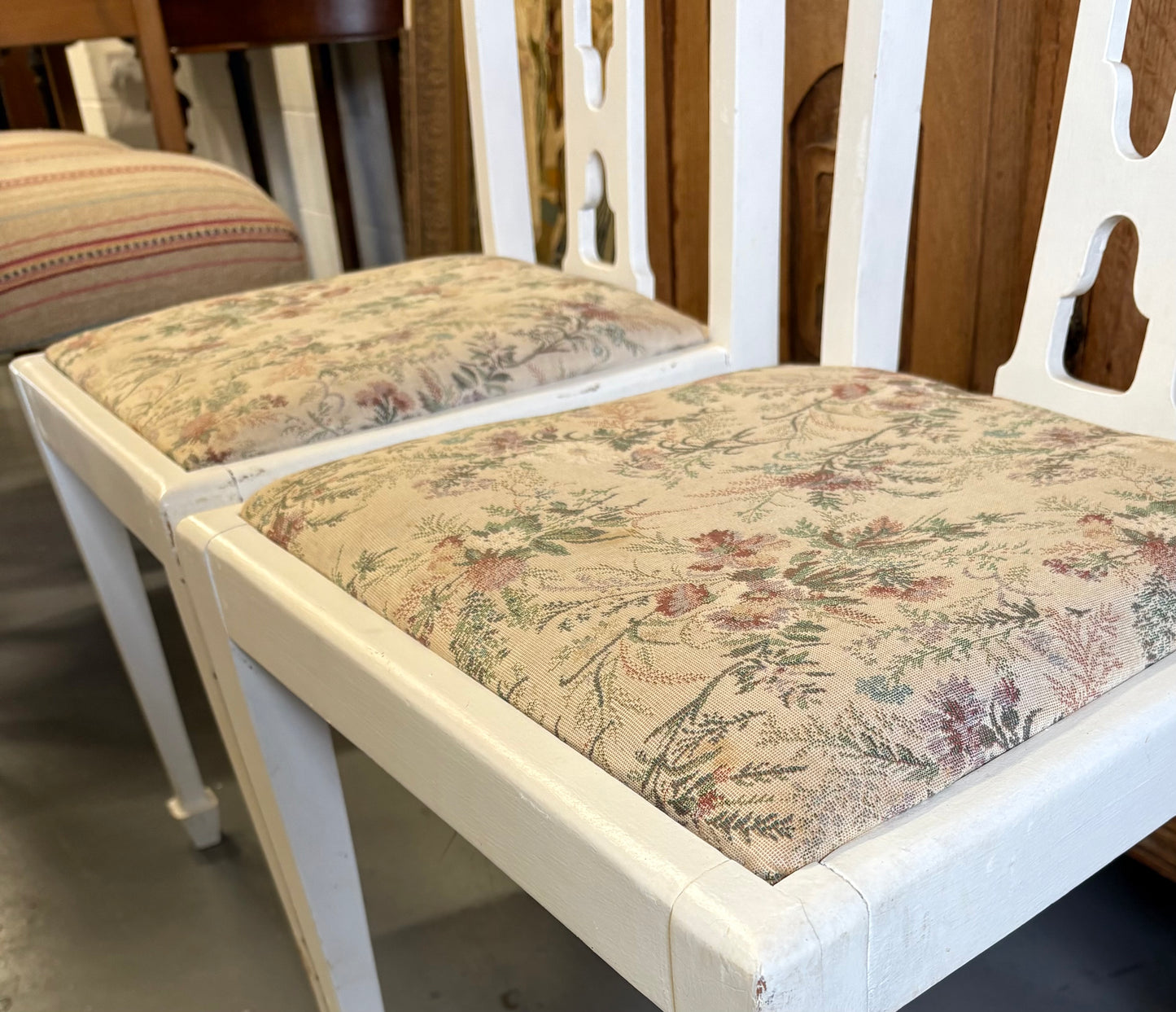 Pair of white fabric covered carved Edwardian occasional or bedroom chairs