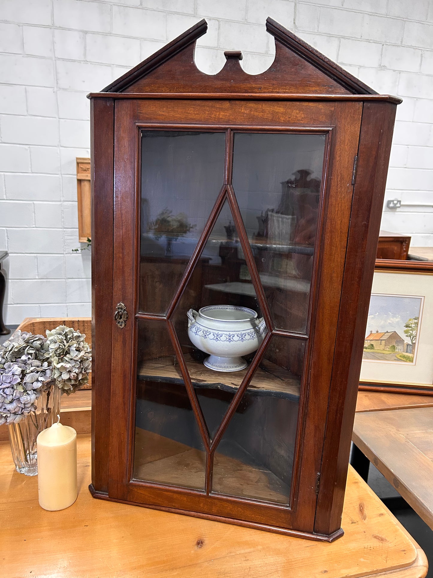 An Edwardian mahogany corner wall cabinet with a glazed front great condition