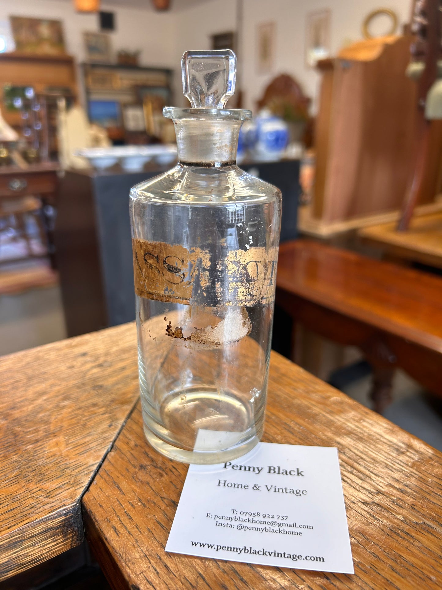 A Victorian apothecary chemists bottle with label and ground glass stopper.