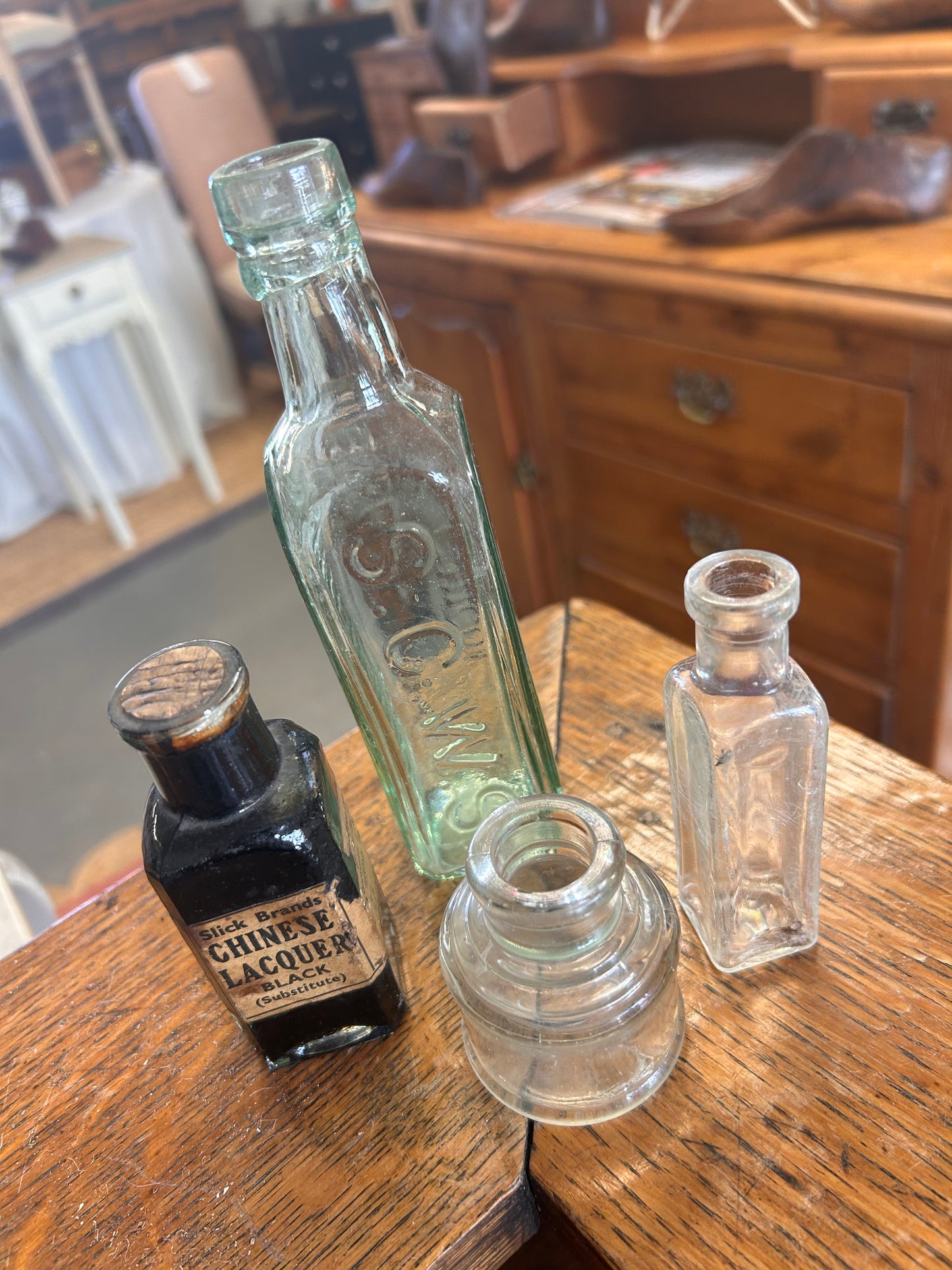 A collection of four vintage original glass bottles for quirky display