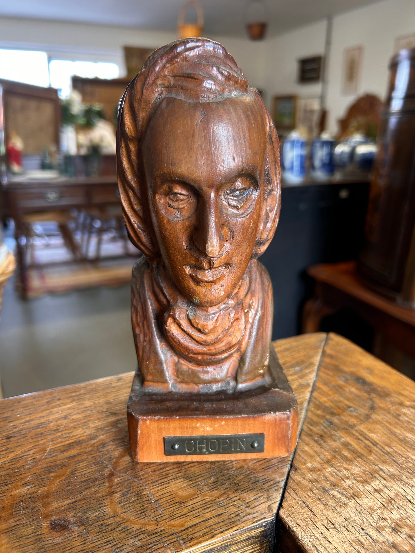 A wooden antique carved bust of the composer Chopin