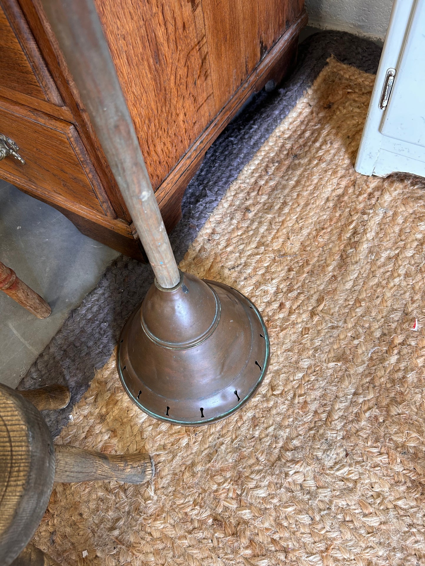 Vintage copper laundry posher great for loo roll storage