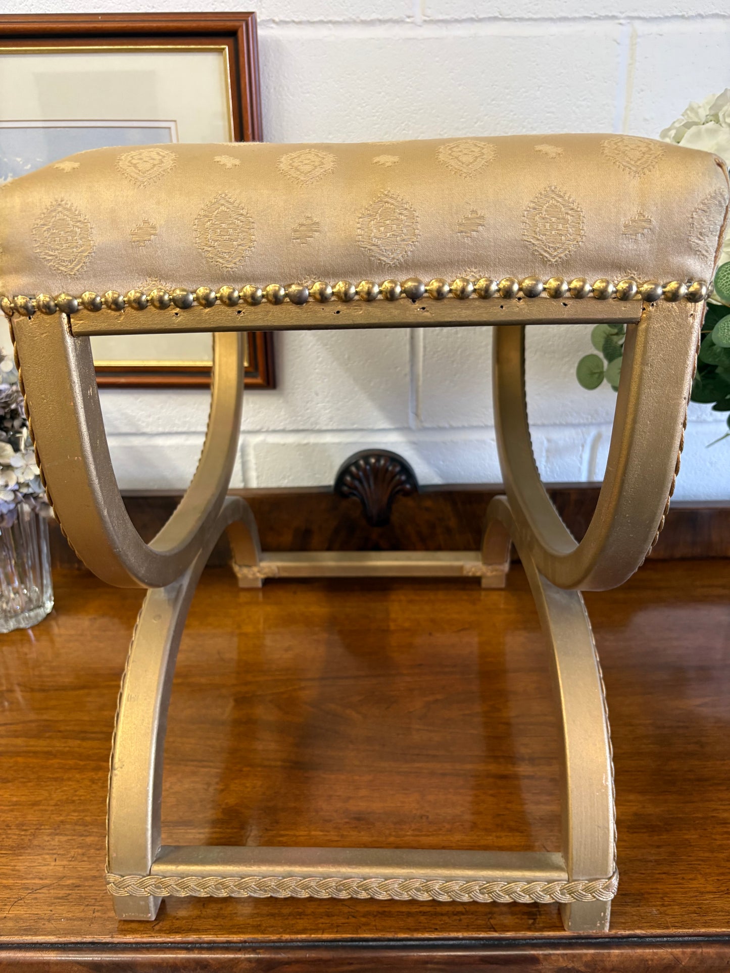 Vintage Regency Yellow Gold upholstered stool with a cross X Frame