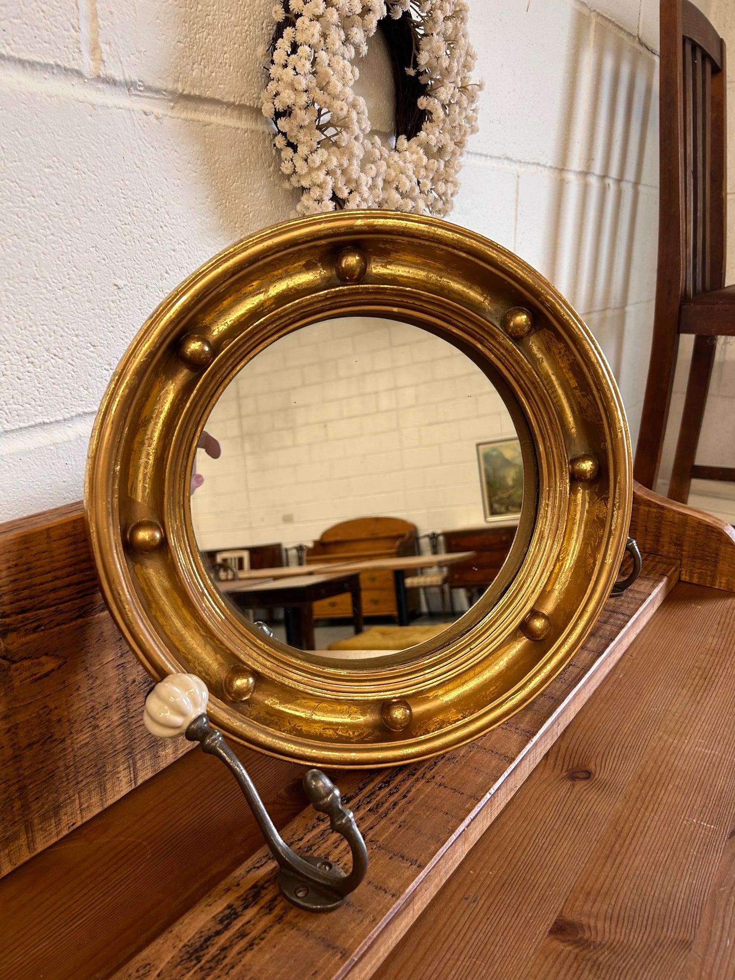 Antique heavy gilt porthole mirror with musket ball frame ￼