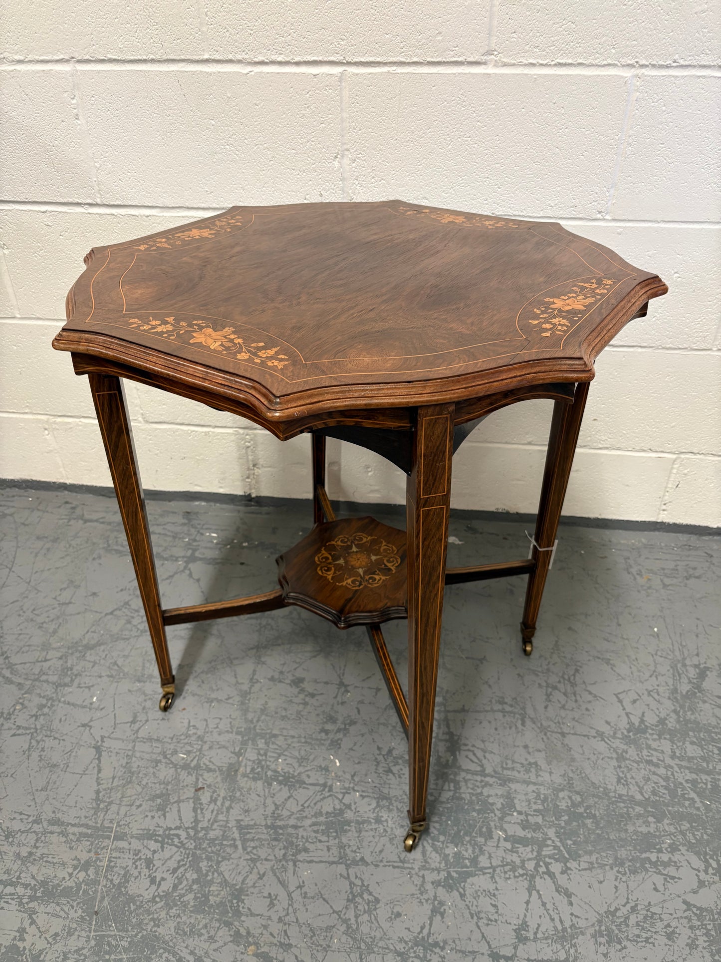 Edwardian inlaid rosewood centre table, octagonal top, square taper legs and undertier