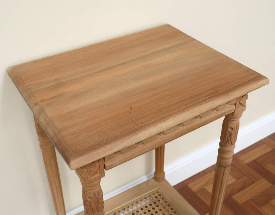 Carved Teak wooden side table with rattan undershelf waxed natural look