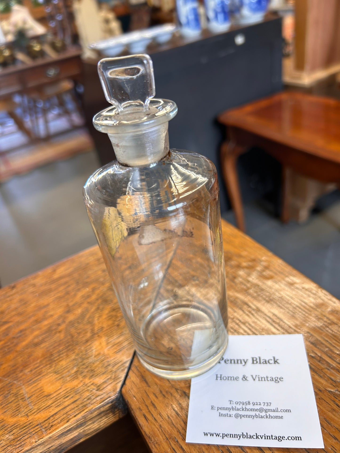 A Victorian apothecary chemists bottle with label and ground glass stopper.