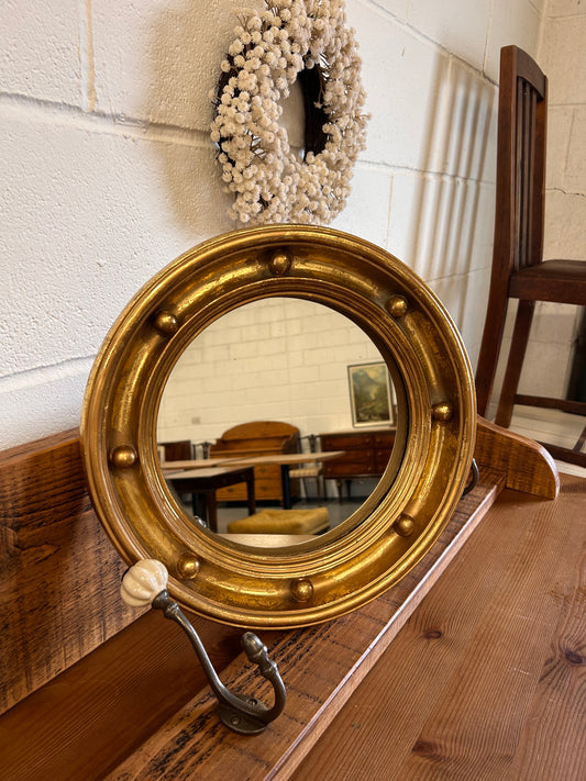 Antique heavy gilt porthole mirror with musket ball frame ￼