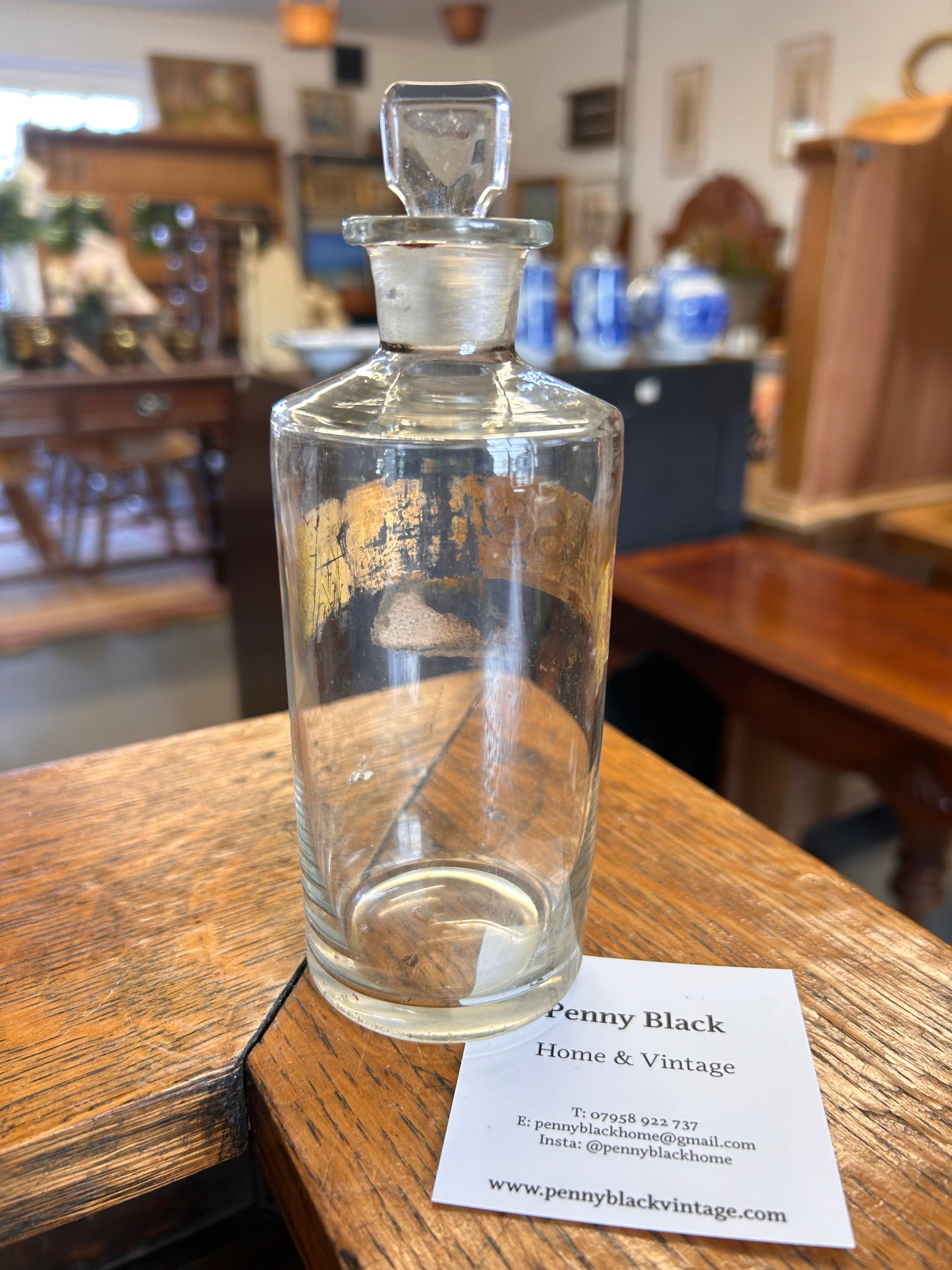 A Victorian apothecary chemists bottle with label and ground glass stopper.