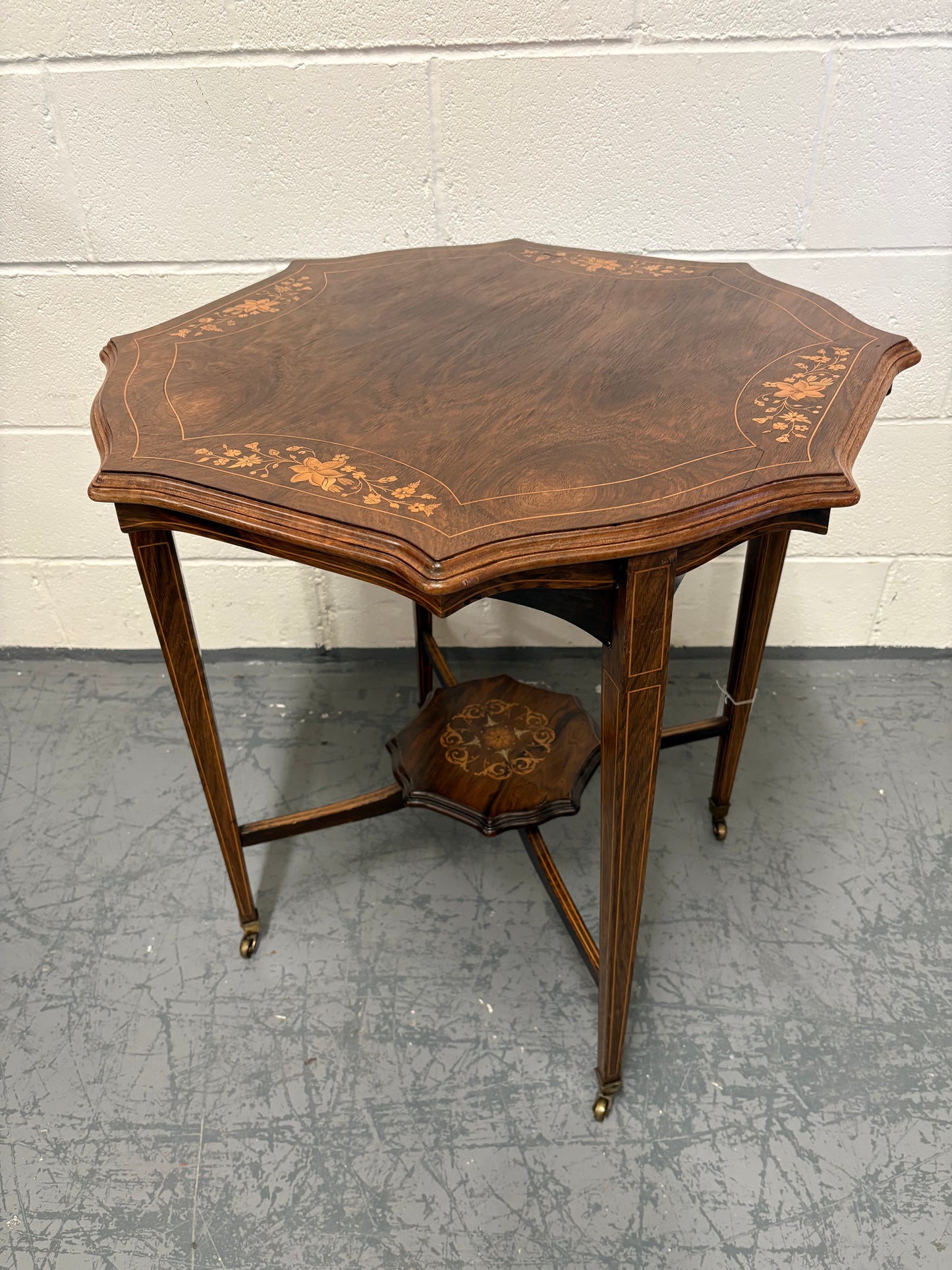 Edwardian inlaid rosewood centre table, octagonal top, square taper legs and undertier