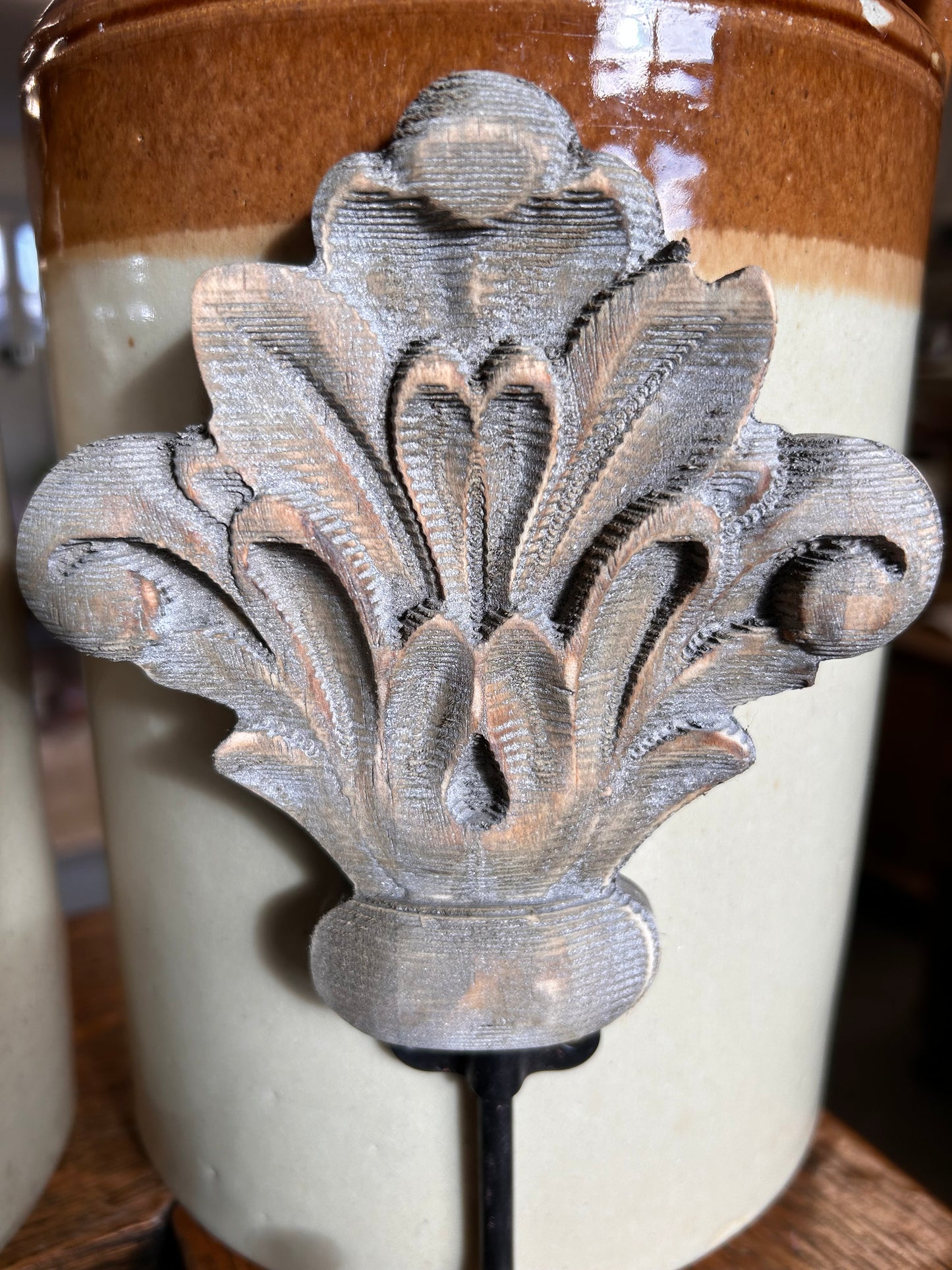 Taupe wood acanthus and black metal wall hook