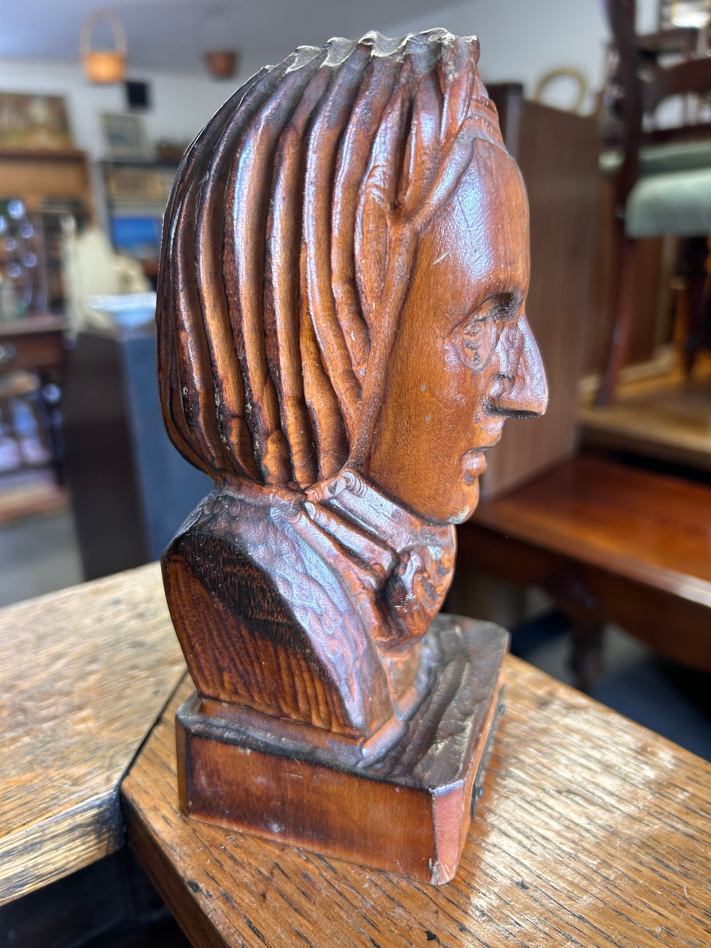 A wooden antique carved bust of the composer Chopin